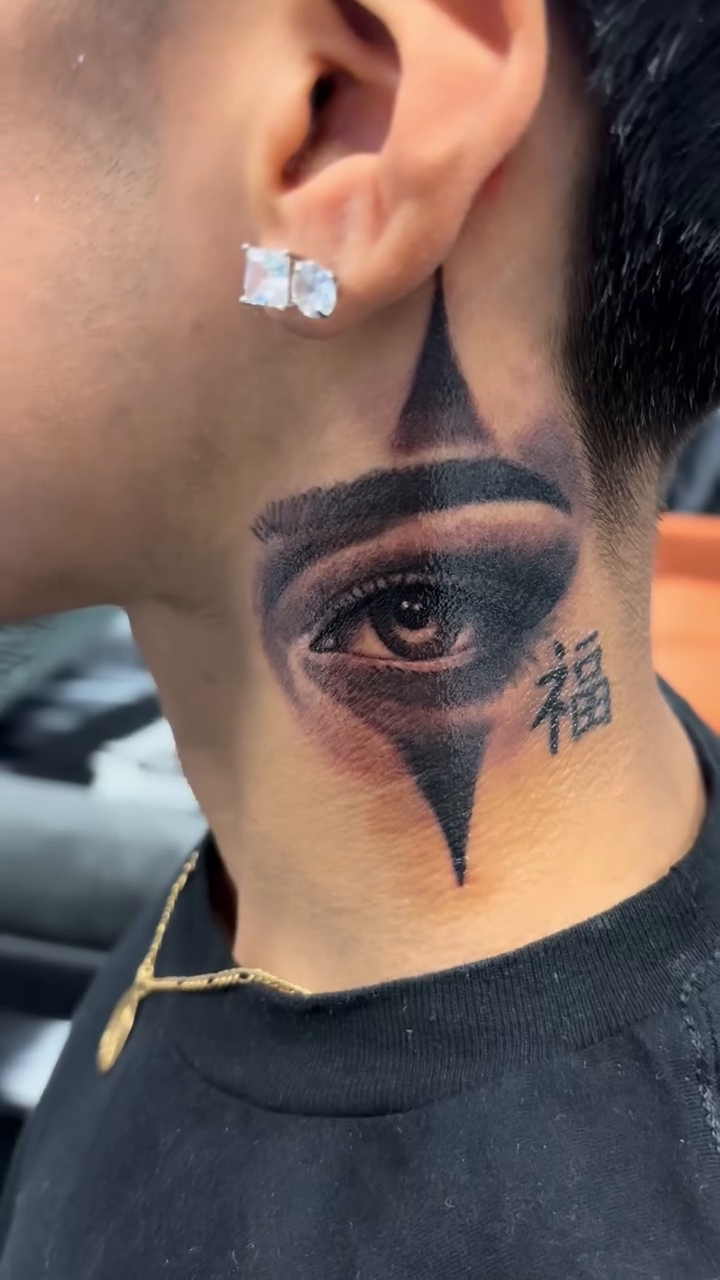 Eye and Japanese character realism tattoo by J.diaz🎖️