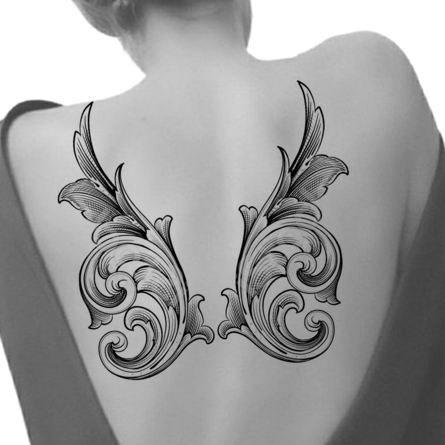 Scrollwork ornamental tattoo on the back by Rachel