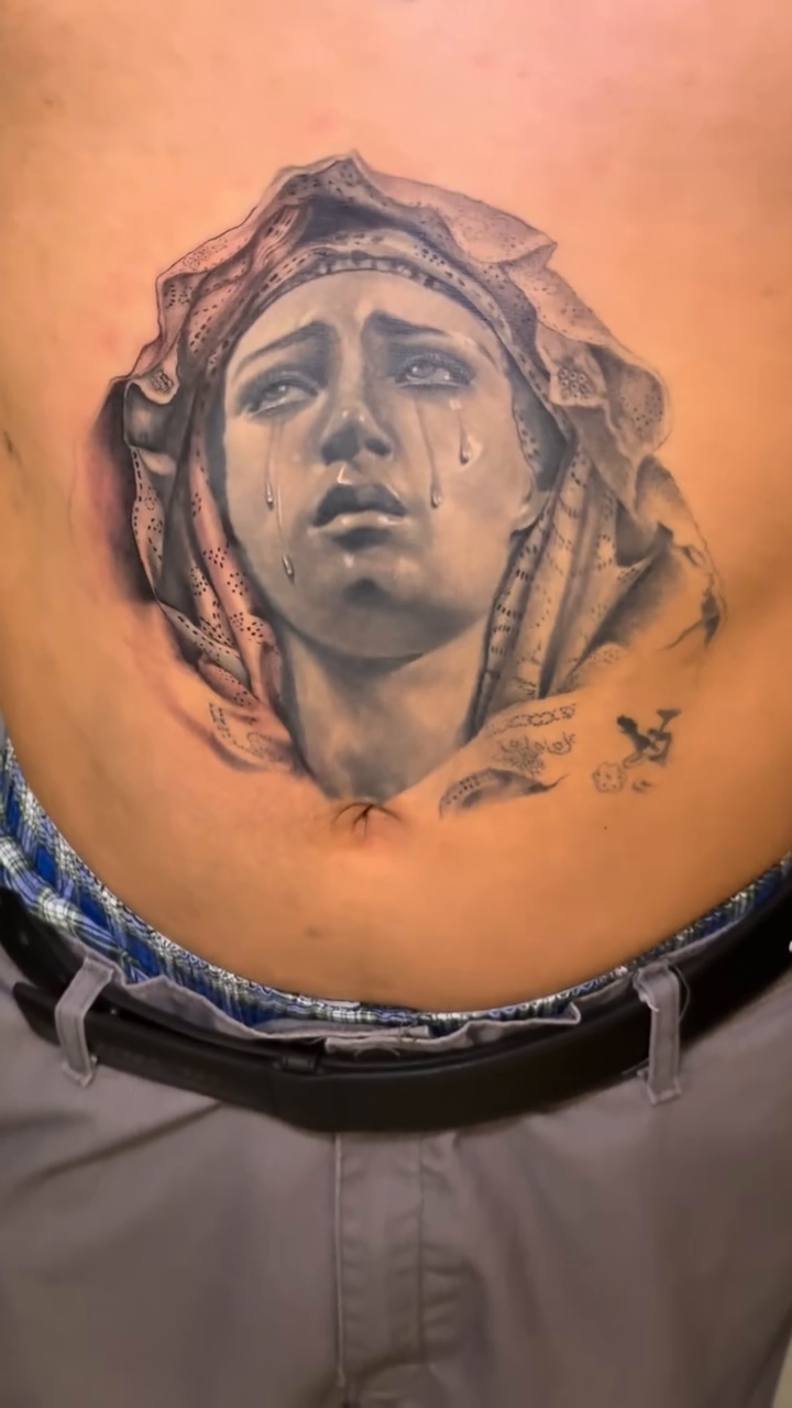 Weeping woman's face realism tattoo by Ian Vanderwerff
