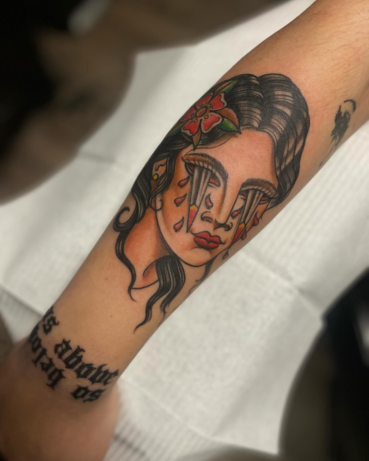 Woman's face American traditional tattoo on the forearm by Chase Skylar Clayton Ogle