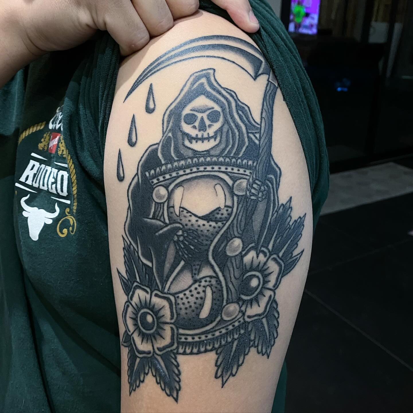 Reaper with scythe black and grey tattoo on the shoulder by Lindsey Cam Van