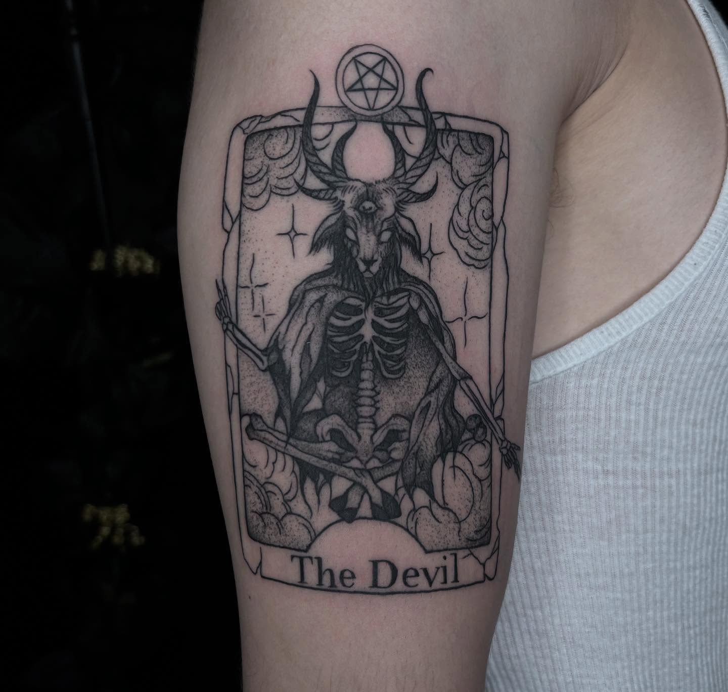 The Devil tarot card black and grey tattoo on the forearm by Ivanna