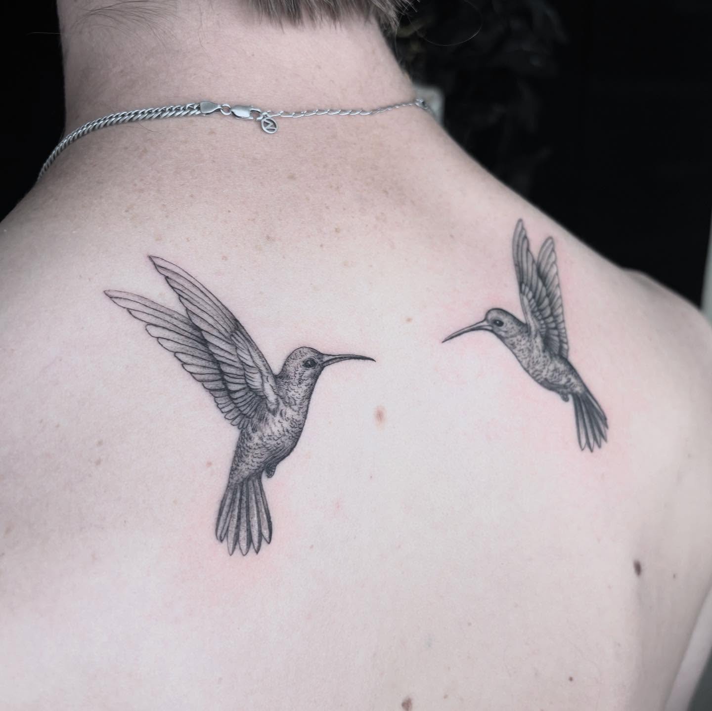 Hummingbirds dotwork tattoo on the back by Ivanna