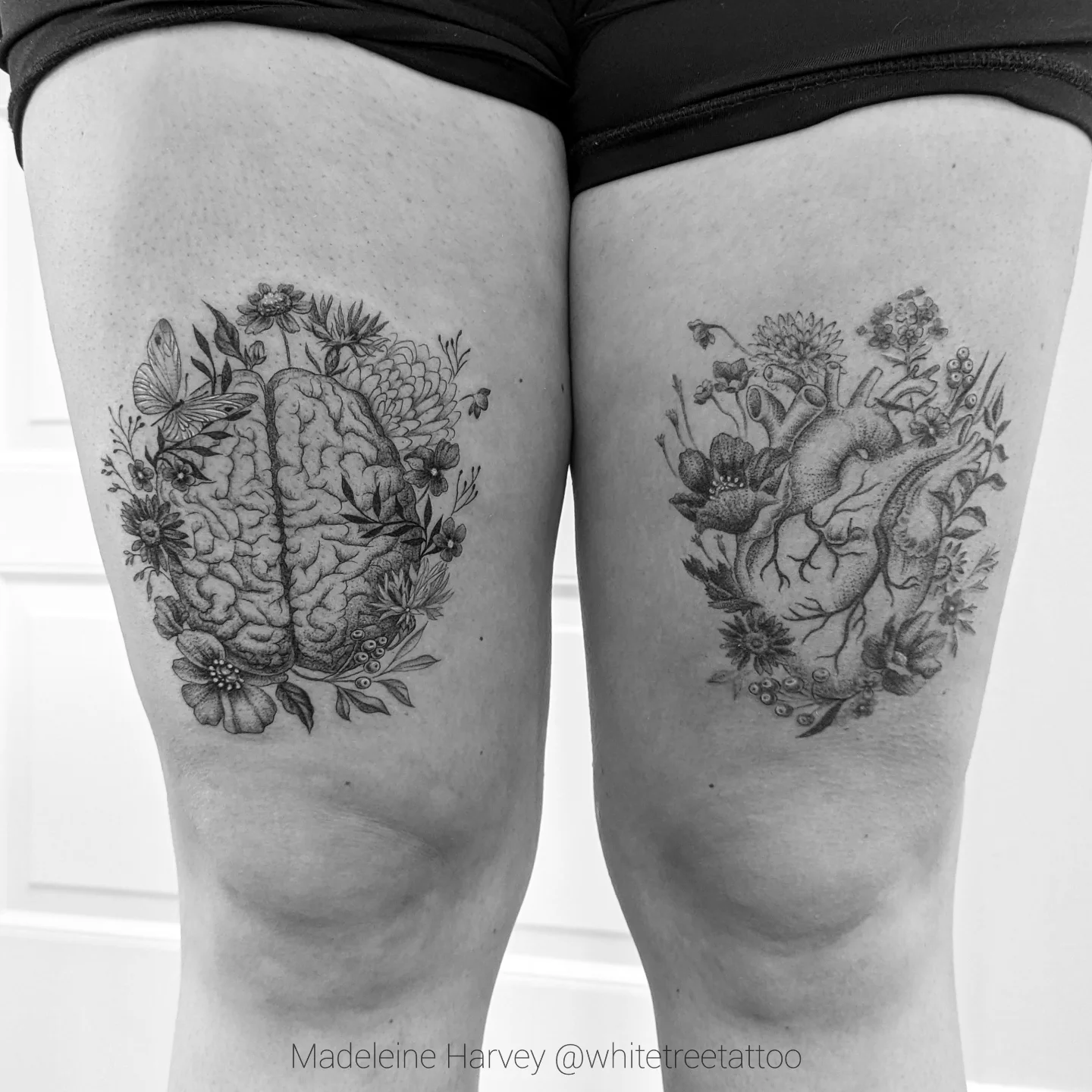 Brain and heart realism tattoo on the thigh by Maddie