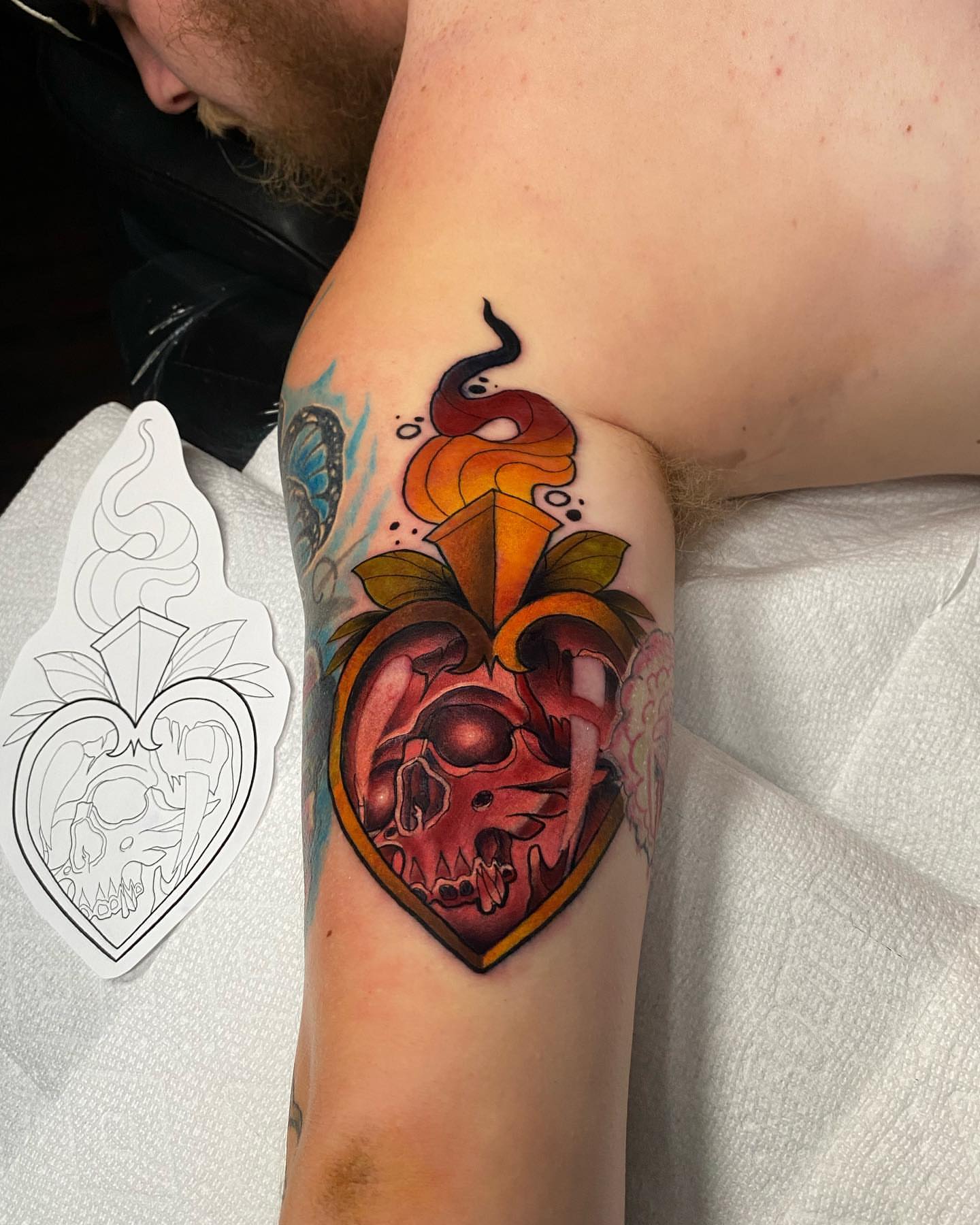 Heart with skull dark realism tattoo on the forearm by Brian Overholt