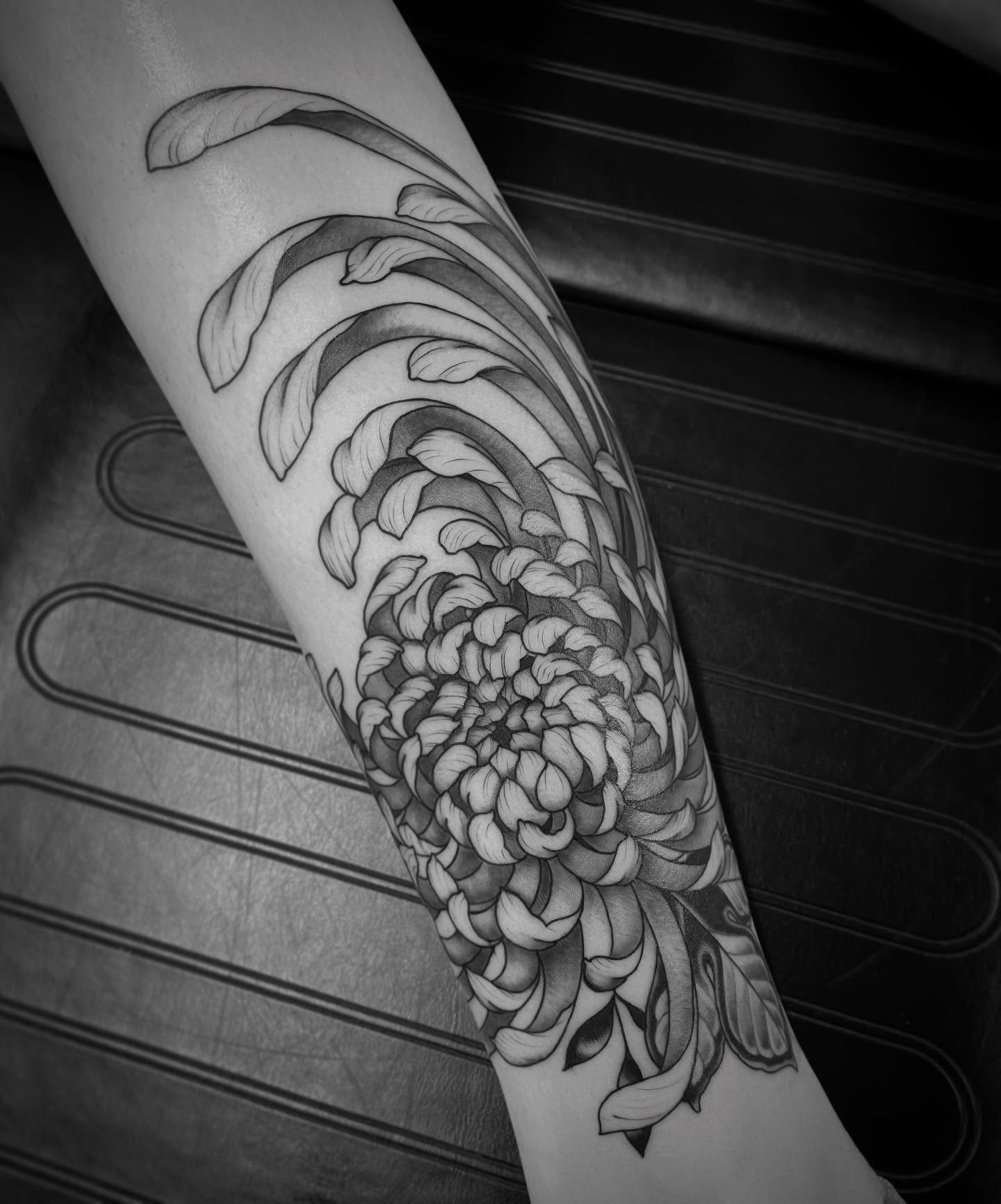 Chrysanthemum japanese irezumi tattoo on the forearm by Jacob Finelli