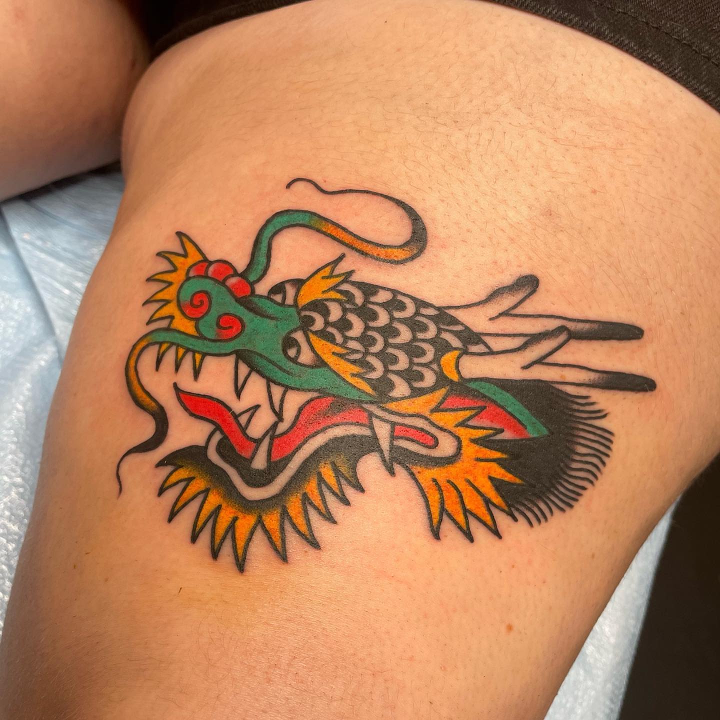 Dragon American traditional tattoo on the thigh by nancy❣️