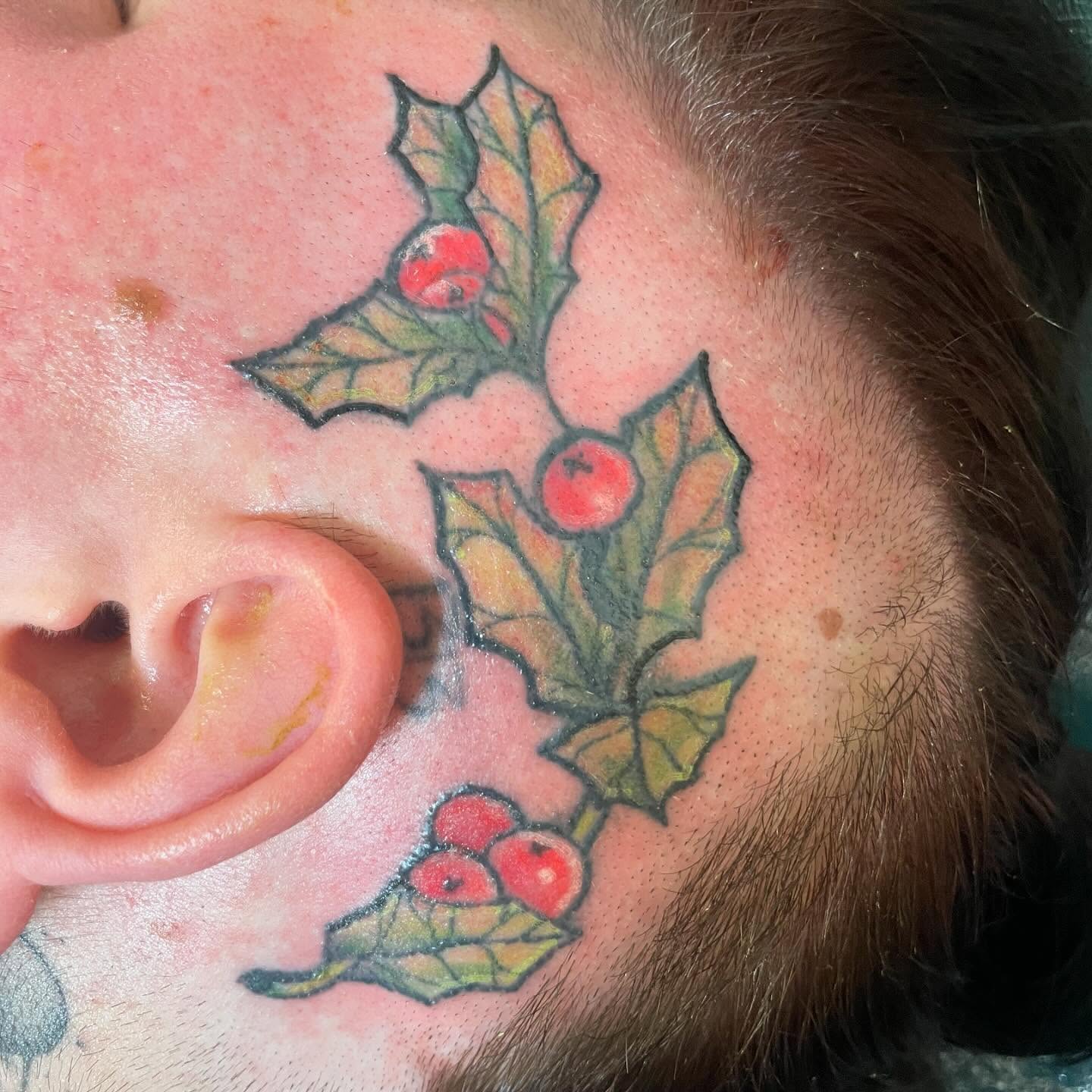 Holly berries American traditional tattoo on the neck by Evan