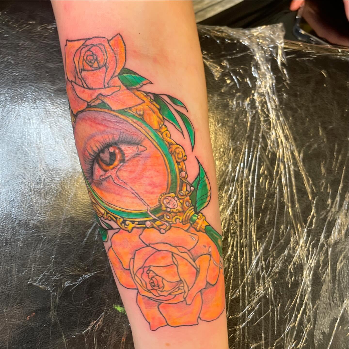 Eye with magnifying glass realism tattoo on the forearm by Evan