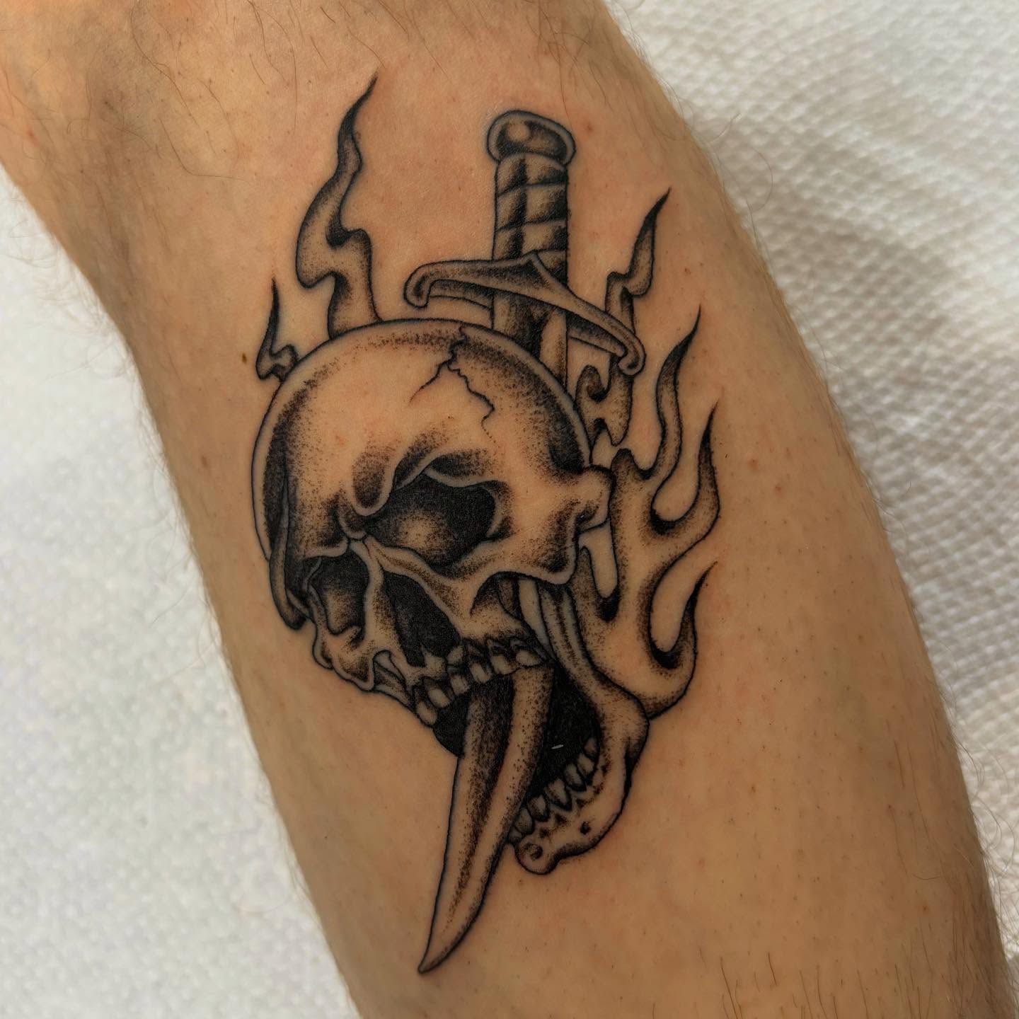 Skull and dagger black and grey tattoo on the forearm by ⟡ Sam O ⟡