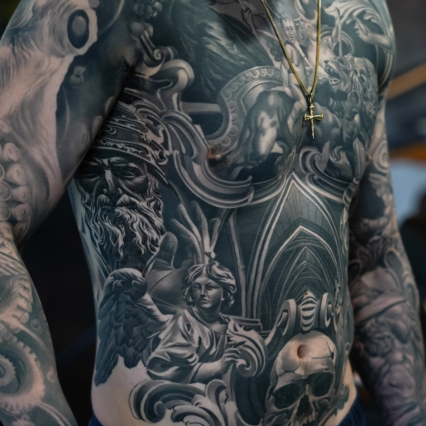 Religious scene realism tattoo on the chest by Fábio Guerreiro