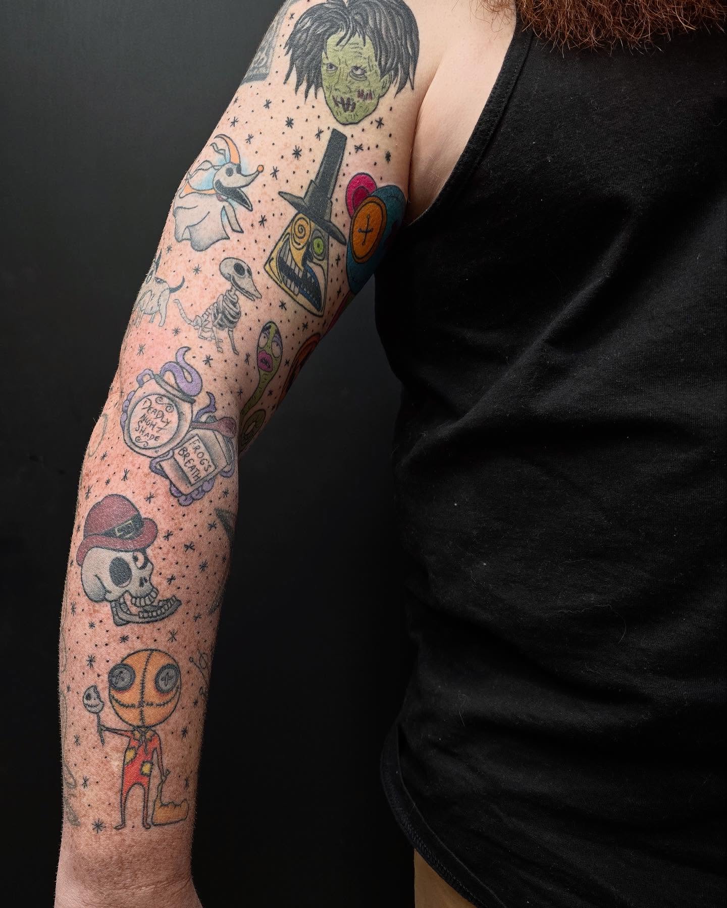 Tim burton-inspired characters dotwork tattoo on the forearm by Diana Guillette