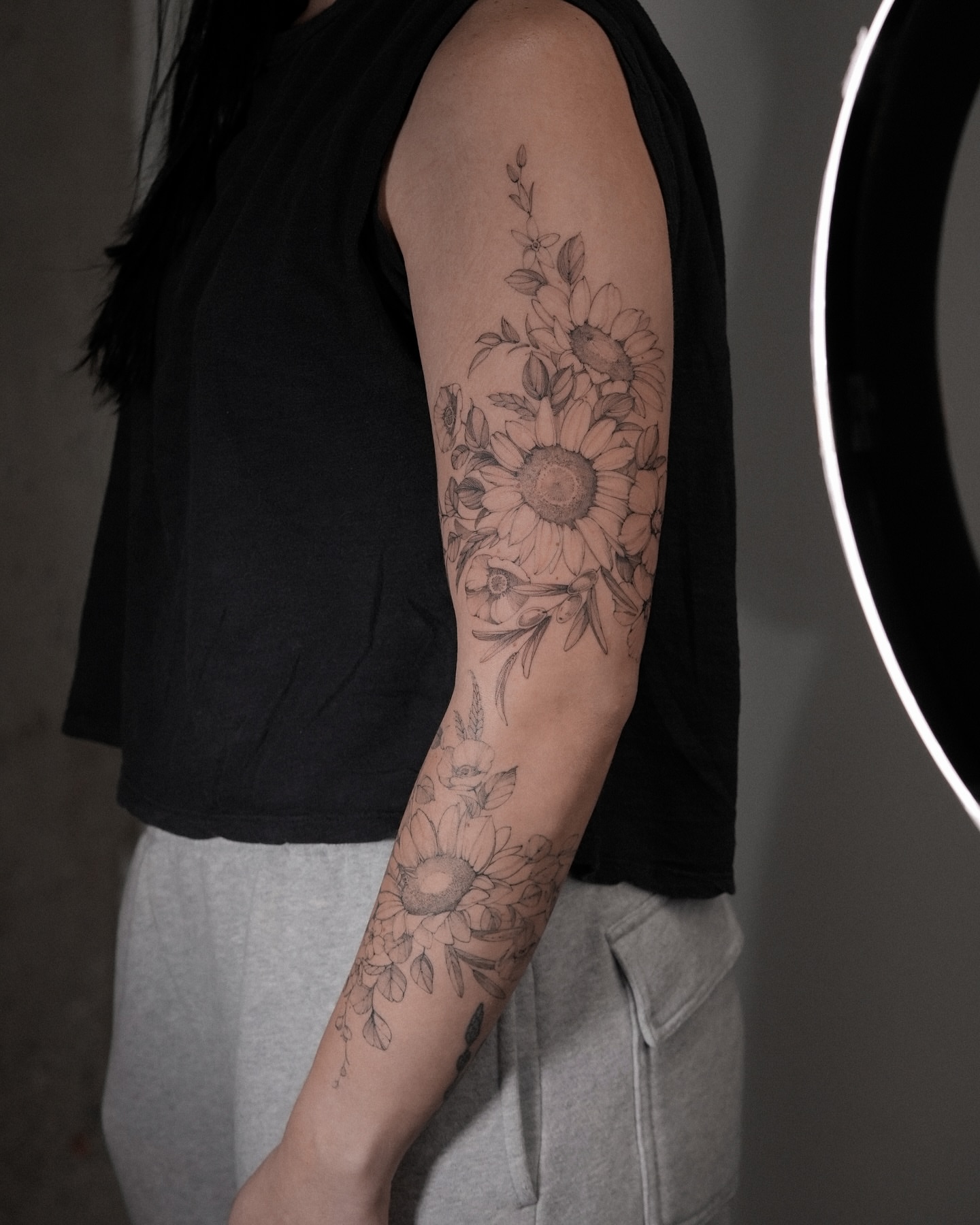 Sunflowers black and grey tattoo on the forearm by Mary Shekh