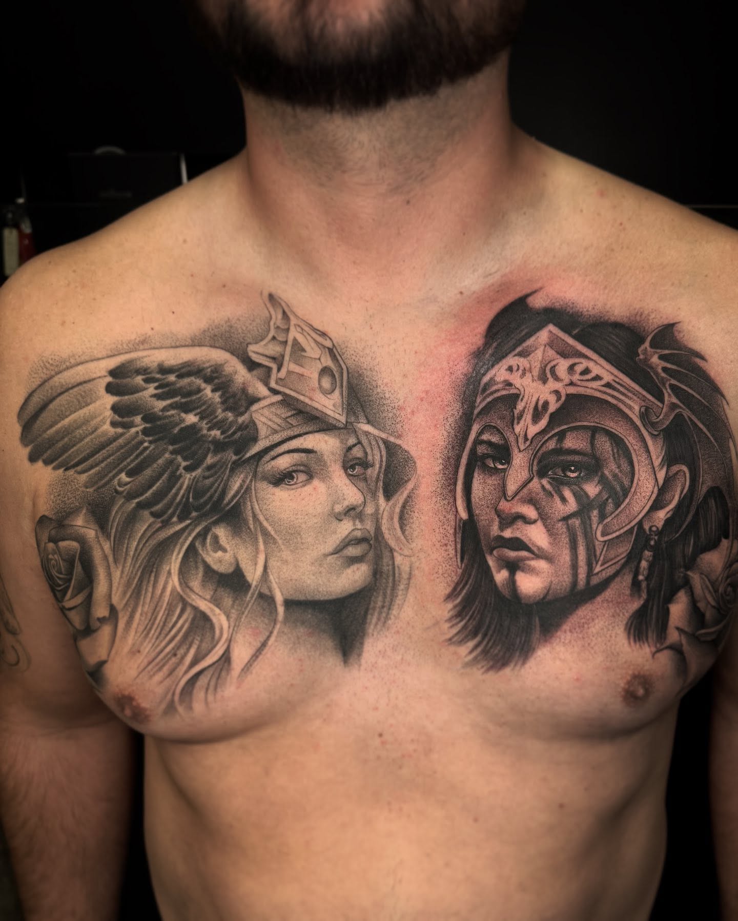 Warrior couple realism tattoo on the chest by Carlos Lujan