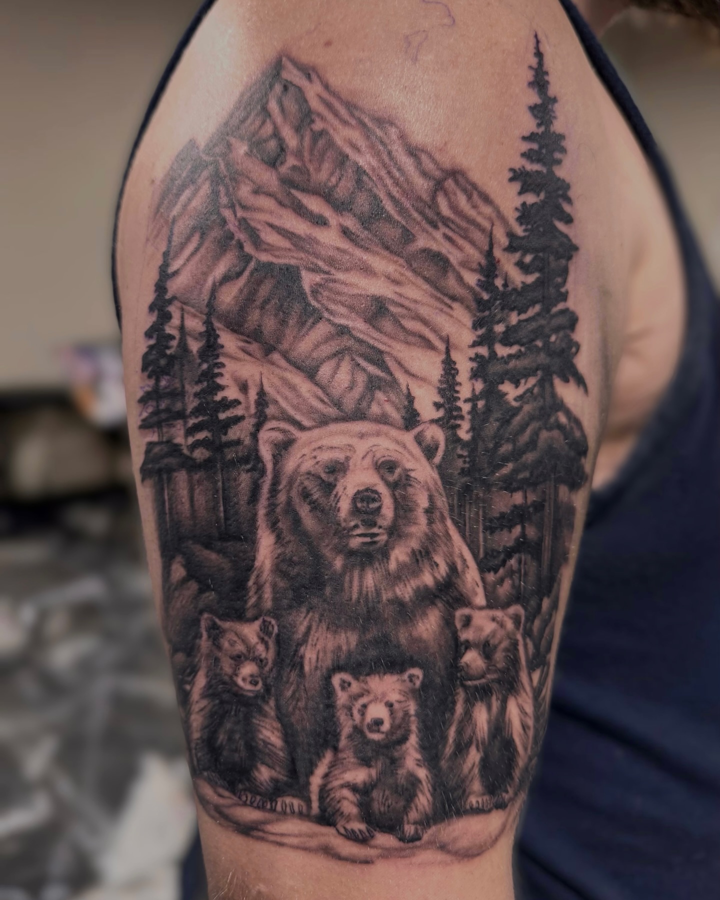 Bear family realism tattoo on the forearm by Suda
