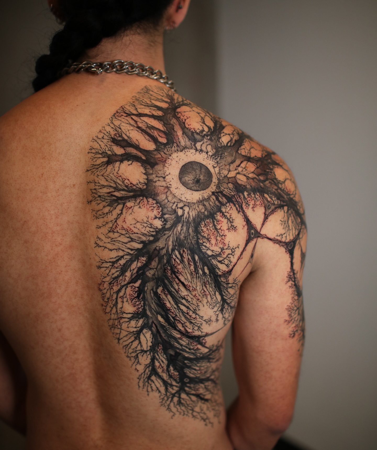 Root system dotwork tattoo on the back by Strokin Konstantin