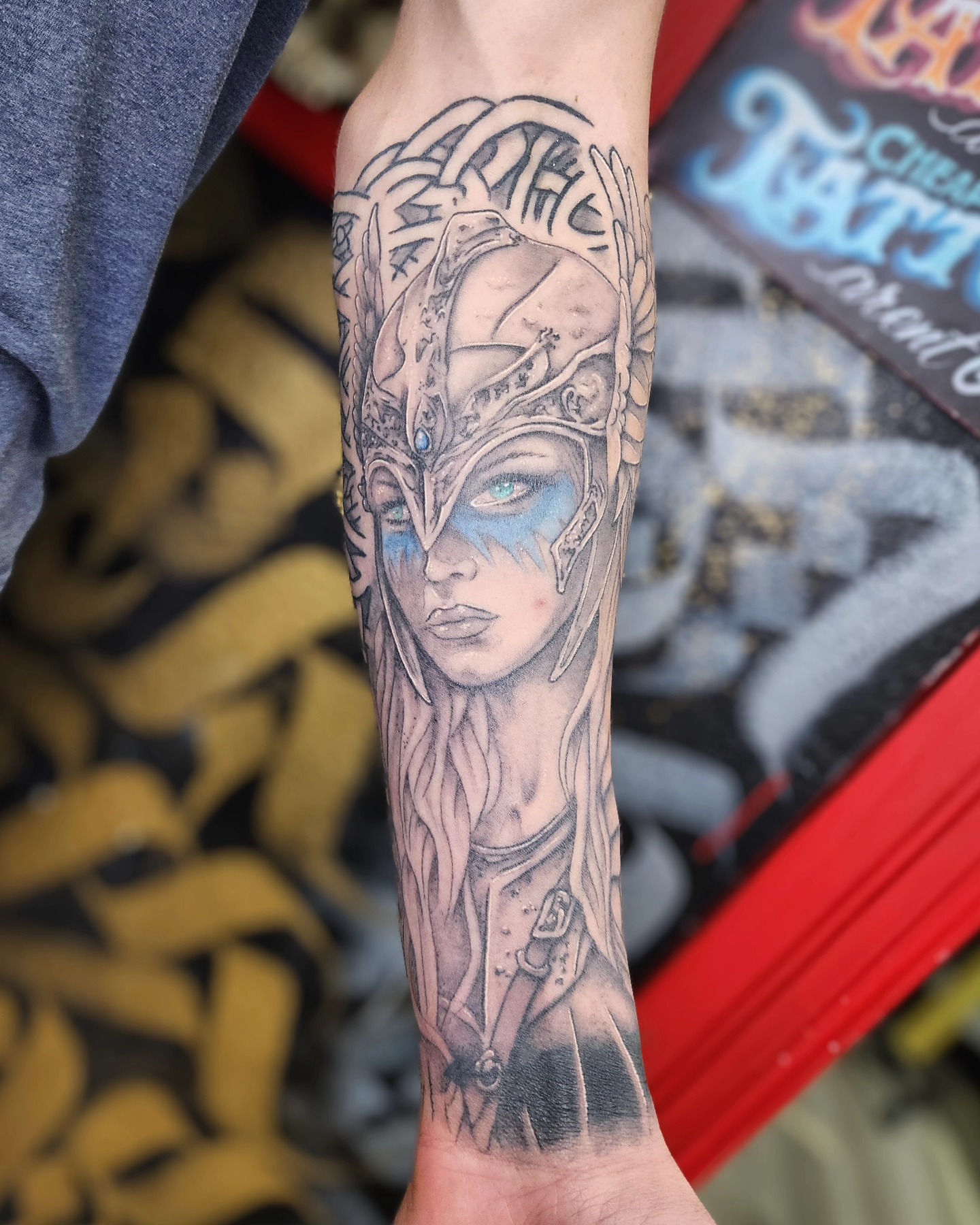 Woman with helmet realism tattoo on the forearm by Bry True