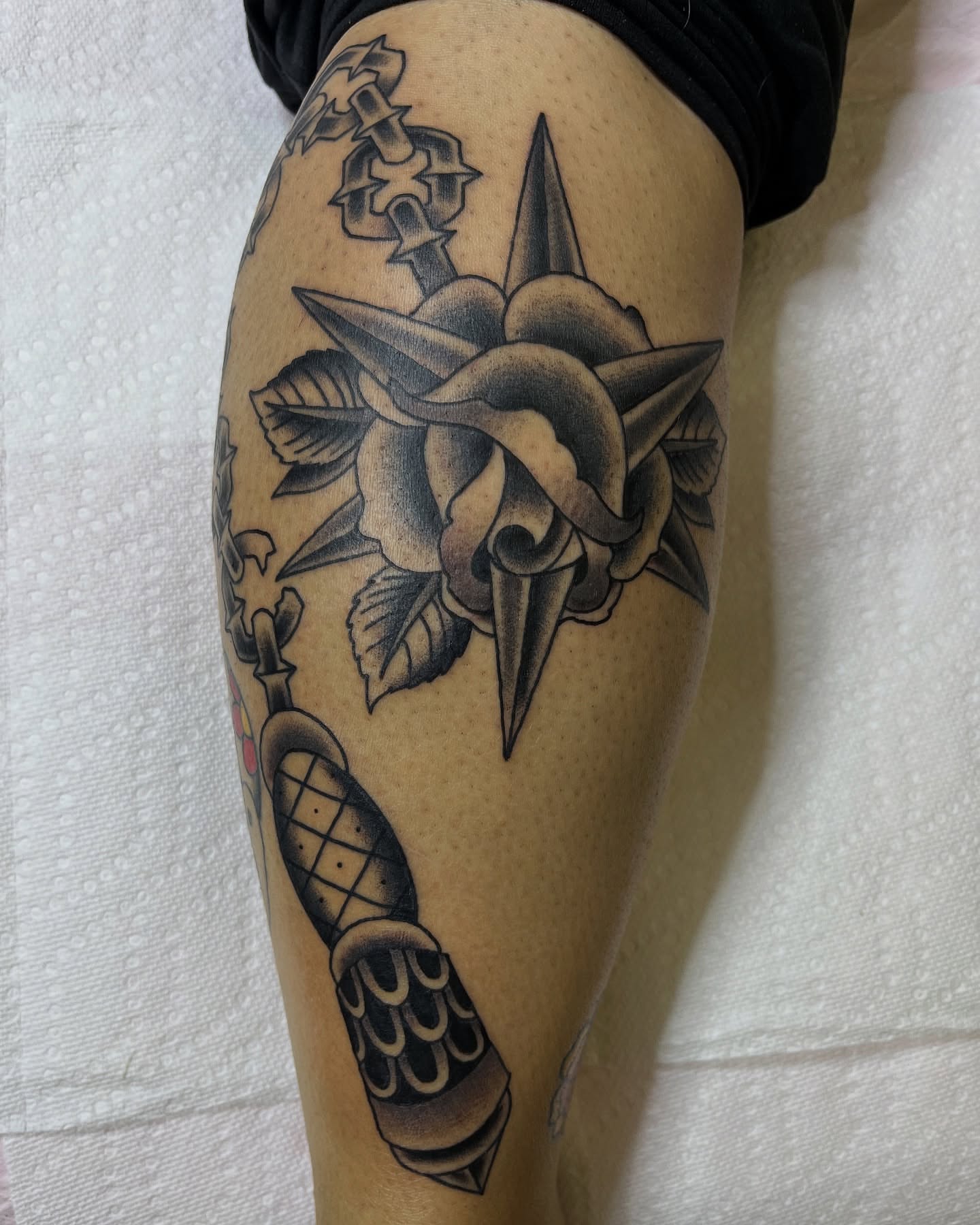 Rose and dagger American traditional tattoo on the thigh by Pedroux M.