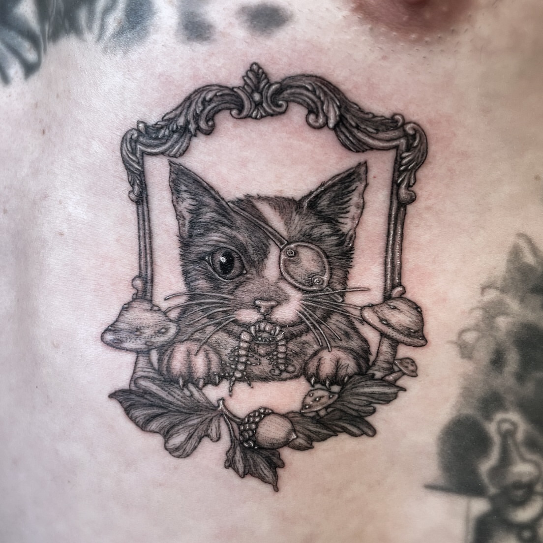 Cat with monocle realism tattoo on the chest by 𝒥𝓊𝓃𝒾𝓅𝑒𝓇 𝒫𝑜𝓈𝓉 (Juju)