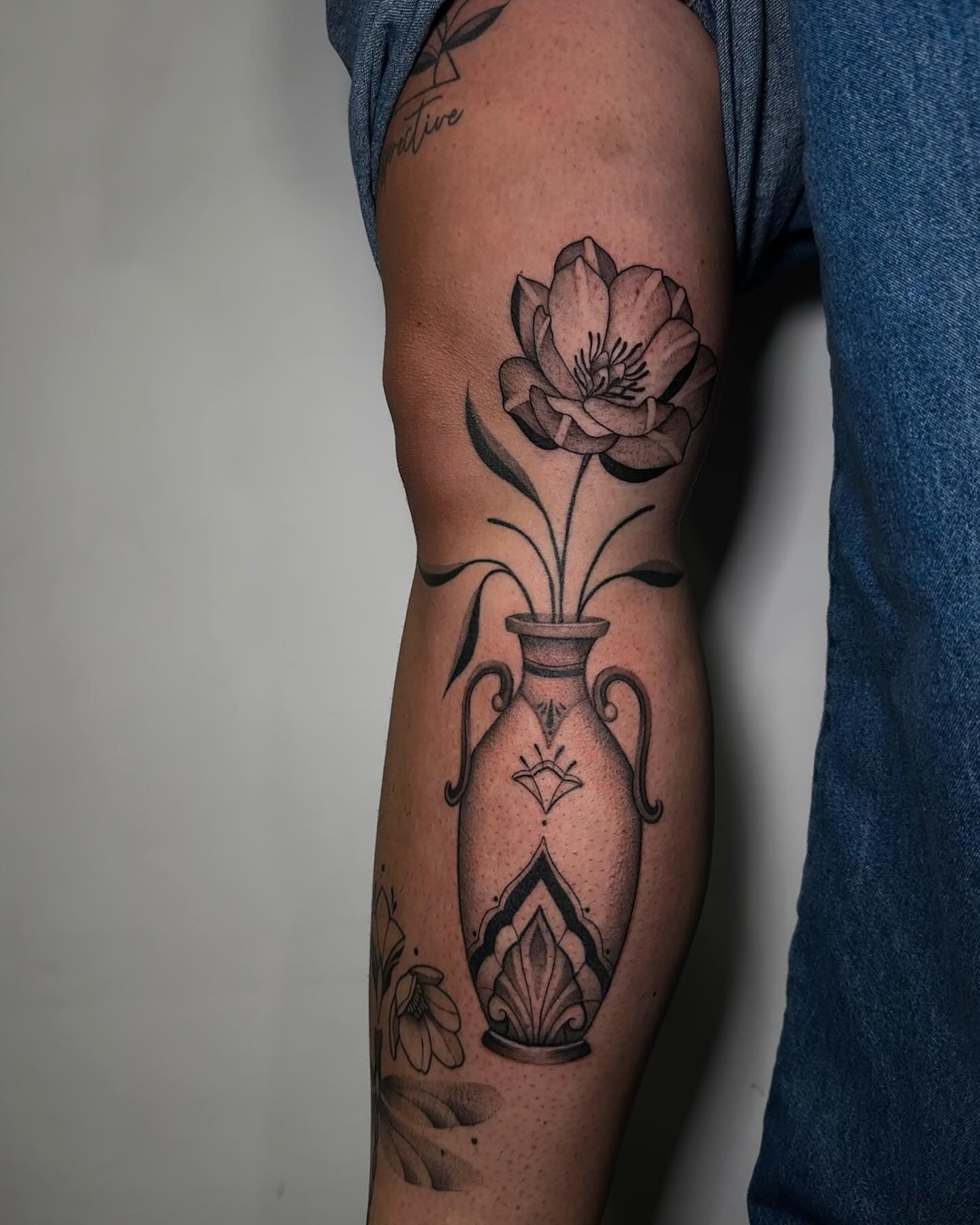 Vase with flower black and grey tattoo on the forearm by @piinkywabbiit, Roselle Park, New Jersey