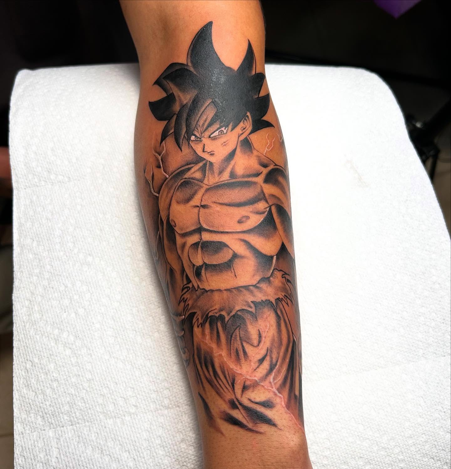Son goku anime tattoo on the forearm by Denis Morello de Castro, South River, New Jersey
