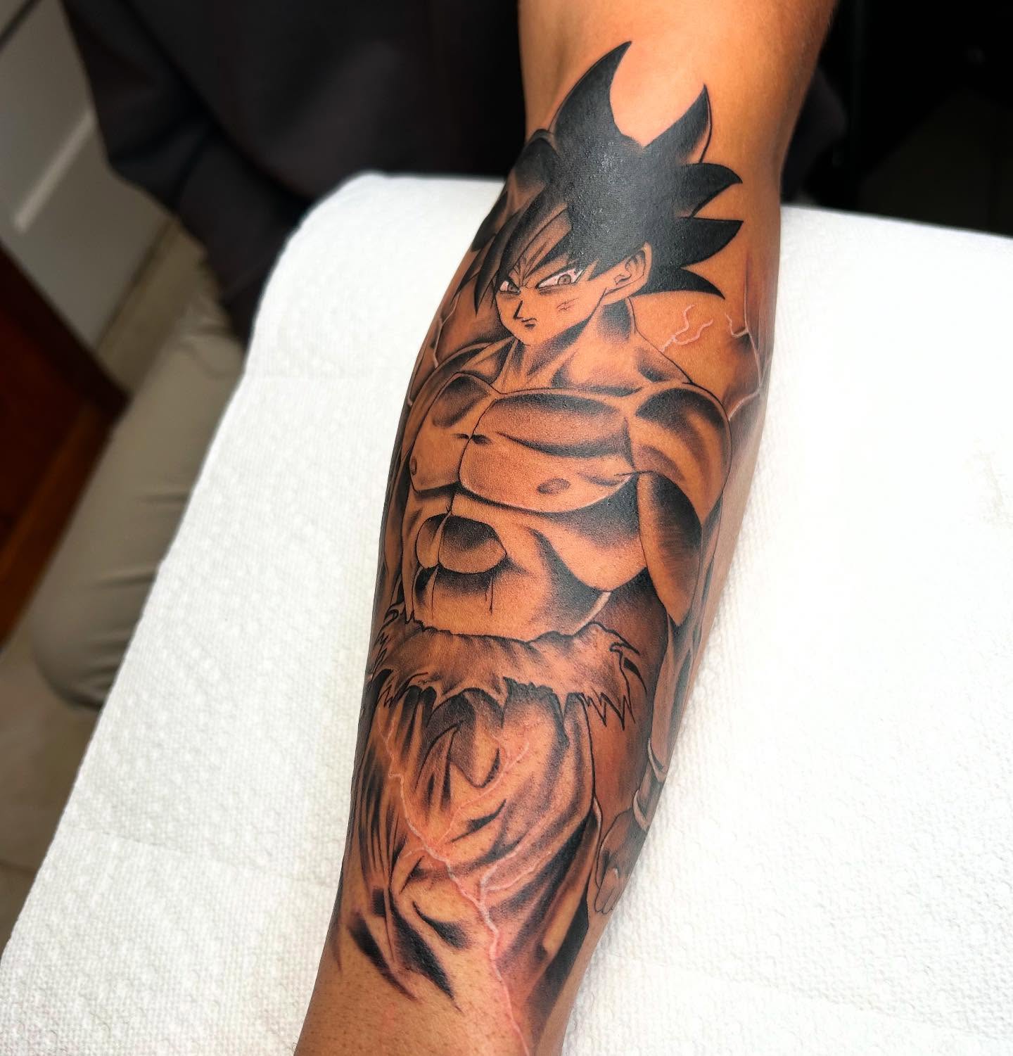 Son goku anime tattoo on the forearm by Denis Morello de Castro, South River, New Jersey