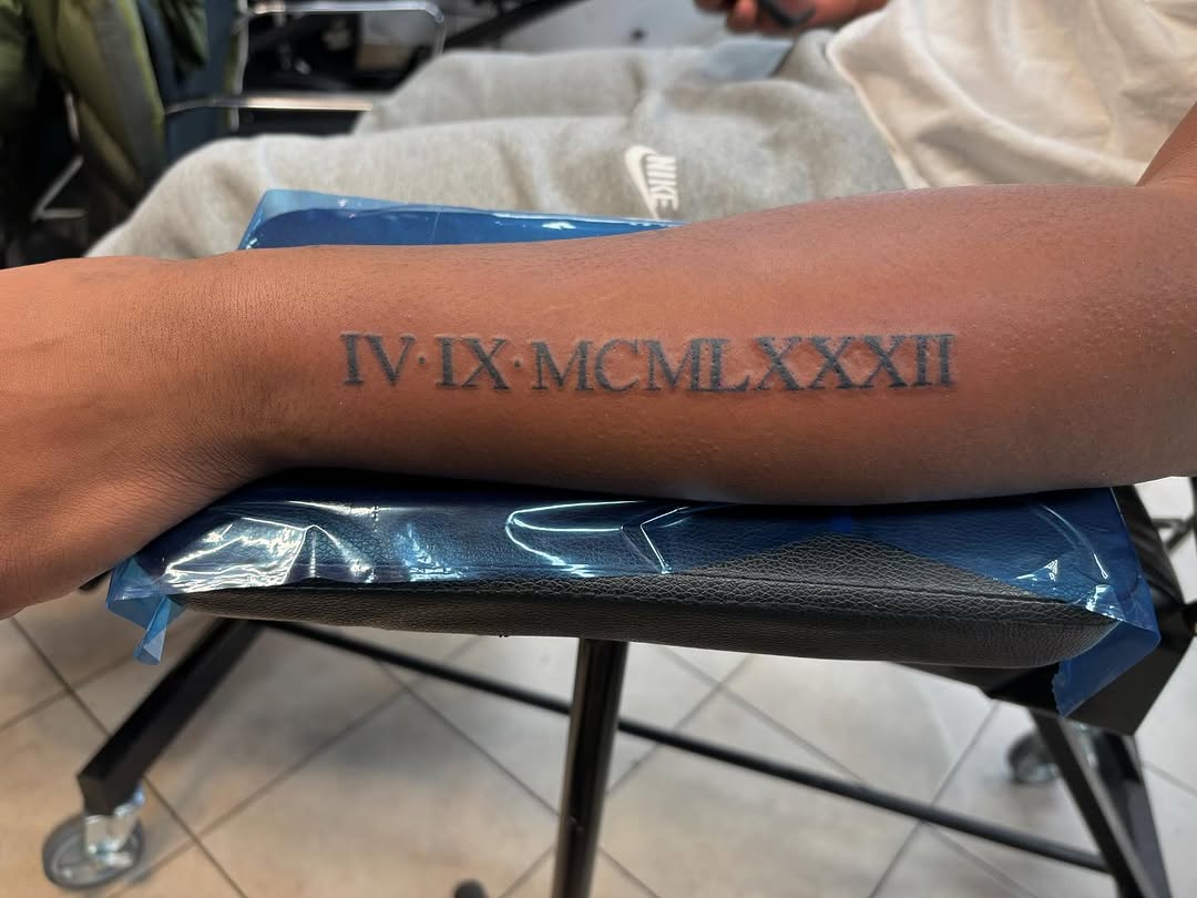 Roman numerals lettering tattoo on the forearm by Lopez Dautruche