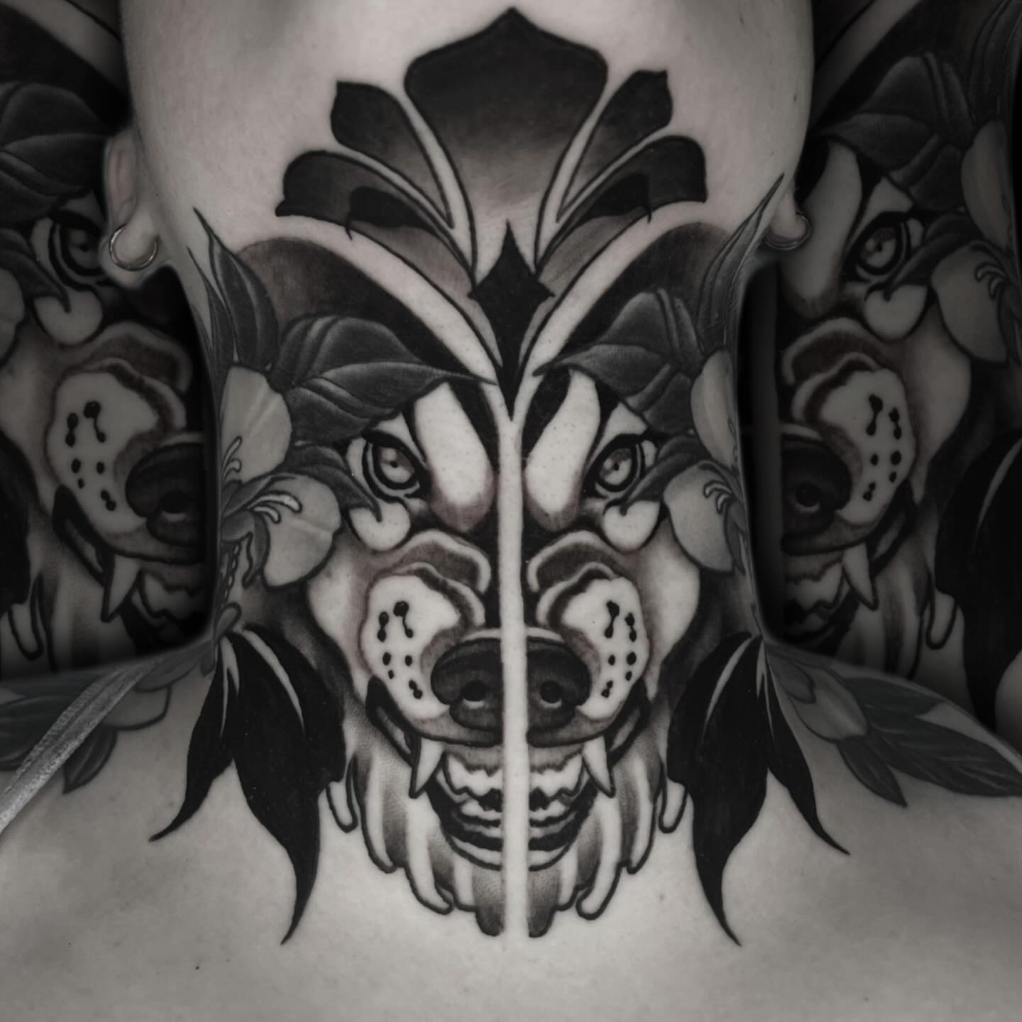Wolf black and grey tattoo on the chest by Nathan Mickle