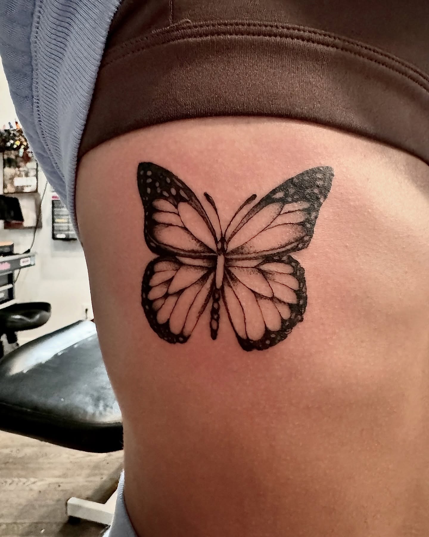 Butterfly dotwork tattoo on the thigh by Matthew Clanin