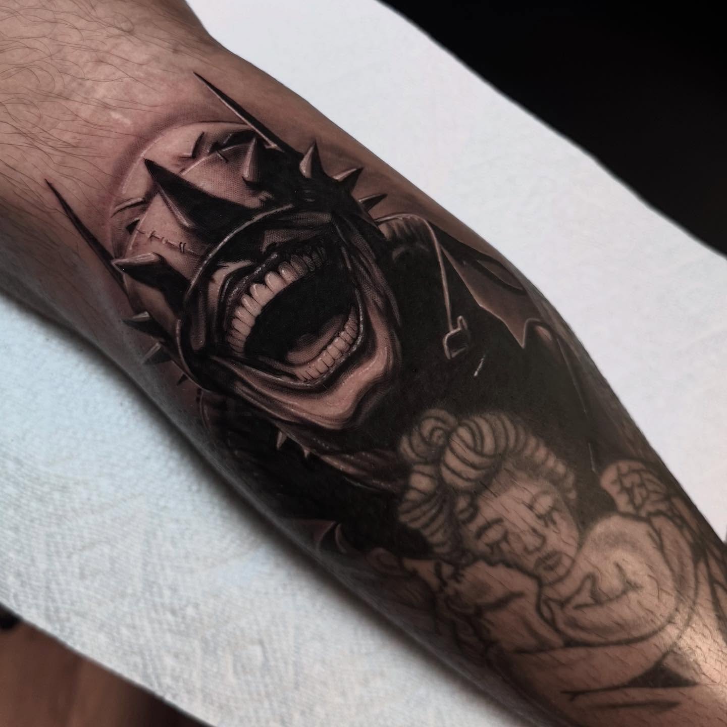 Demon dark realism tattoo on the forearm by Jake Fujimura