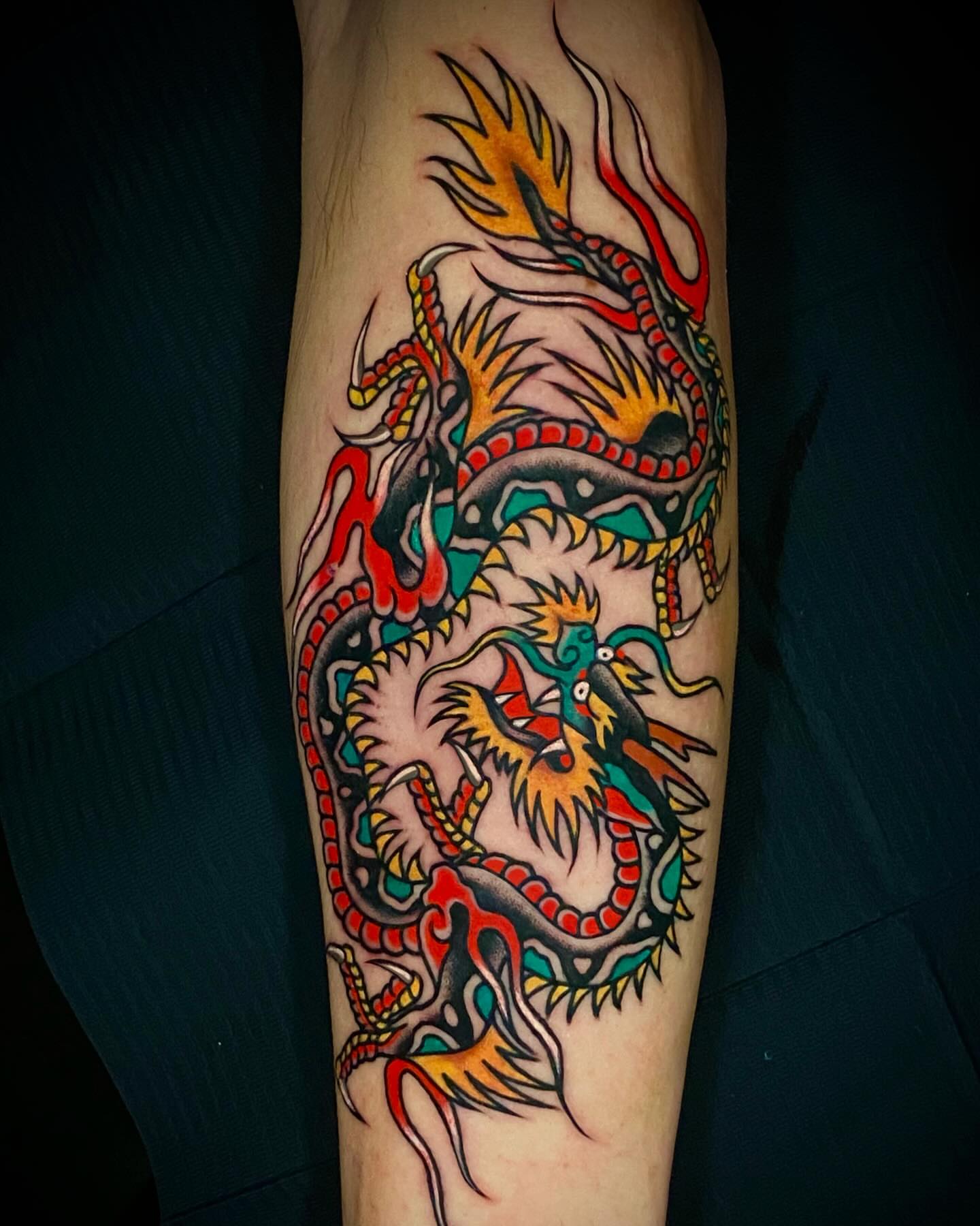 Dragon American traditional tattoo on the forearm by Alex Muniz