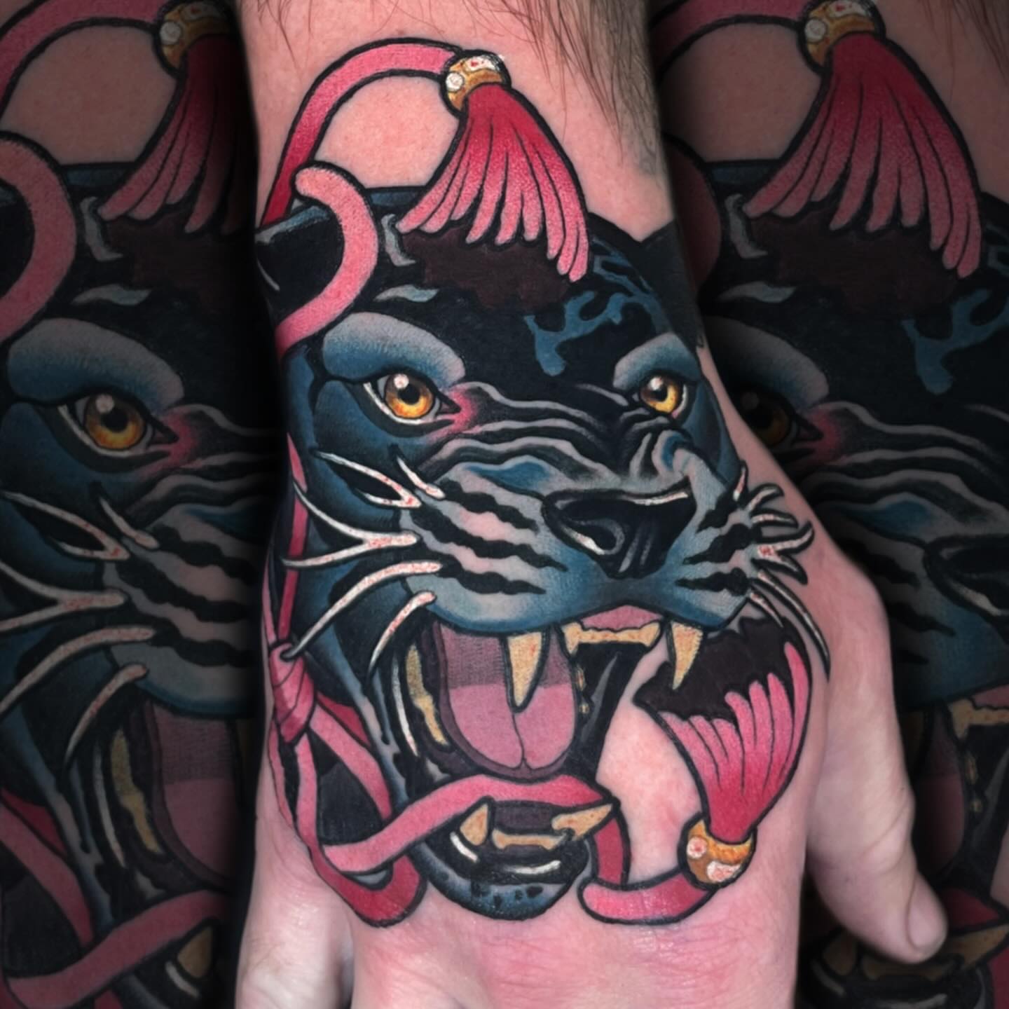 Panther American traditional tattoo on the hand by Nathan Mickle