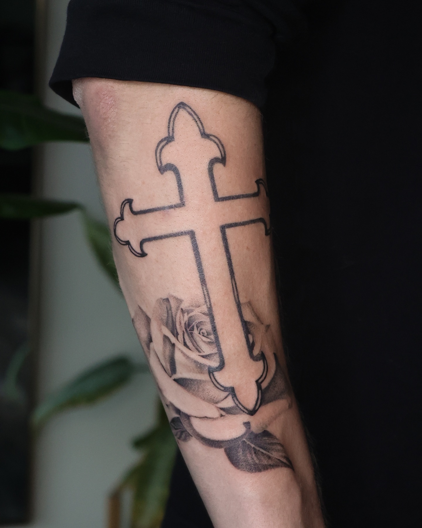 Cross with rose black and grey tattoo on the forearm by Beans