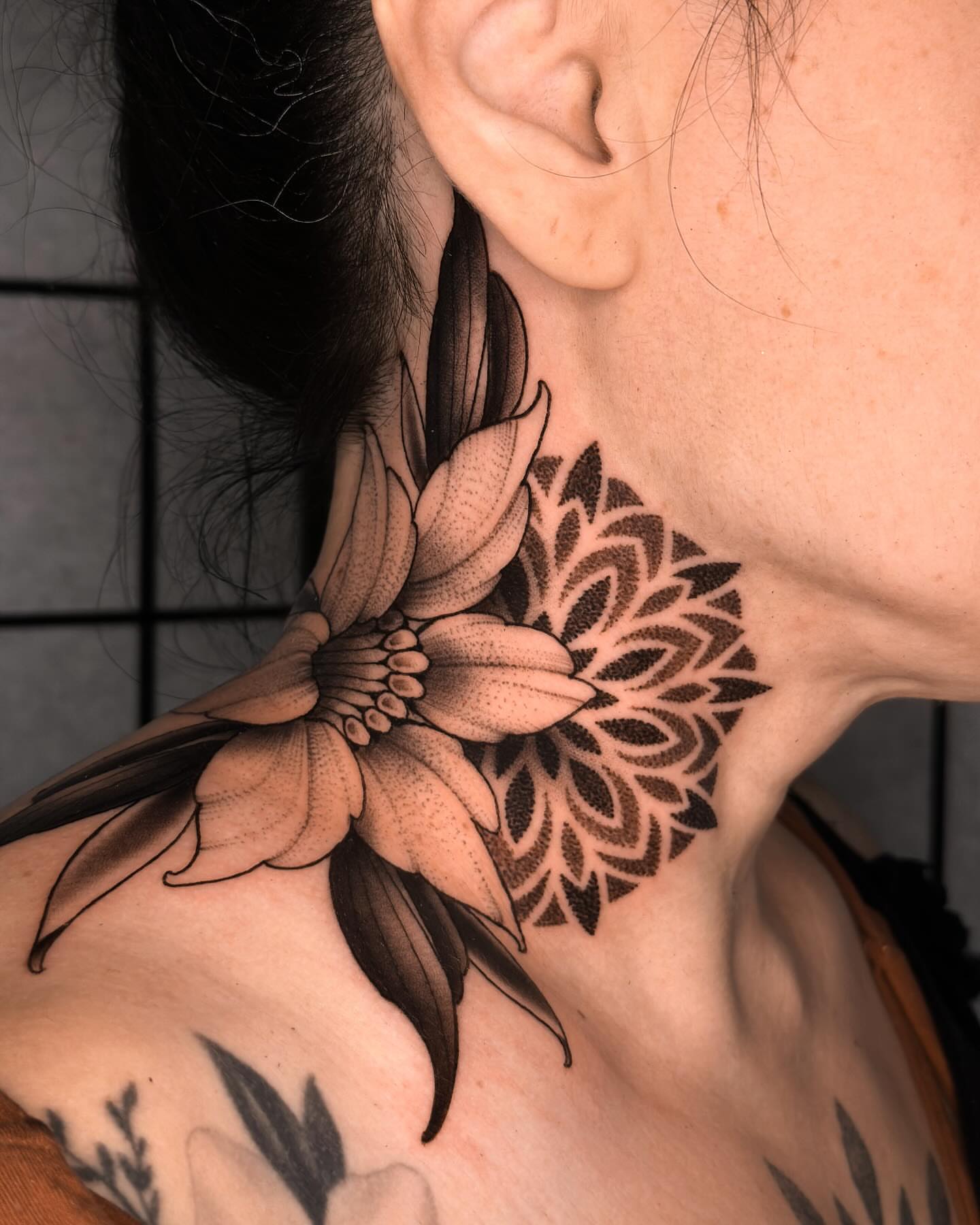 Flower dotwork tattoo on the neck by San Diego