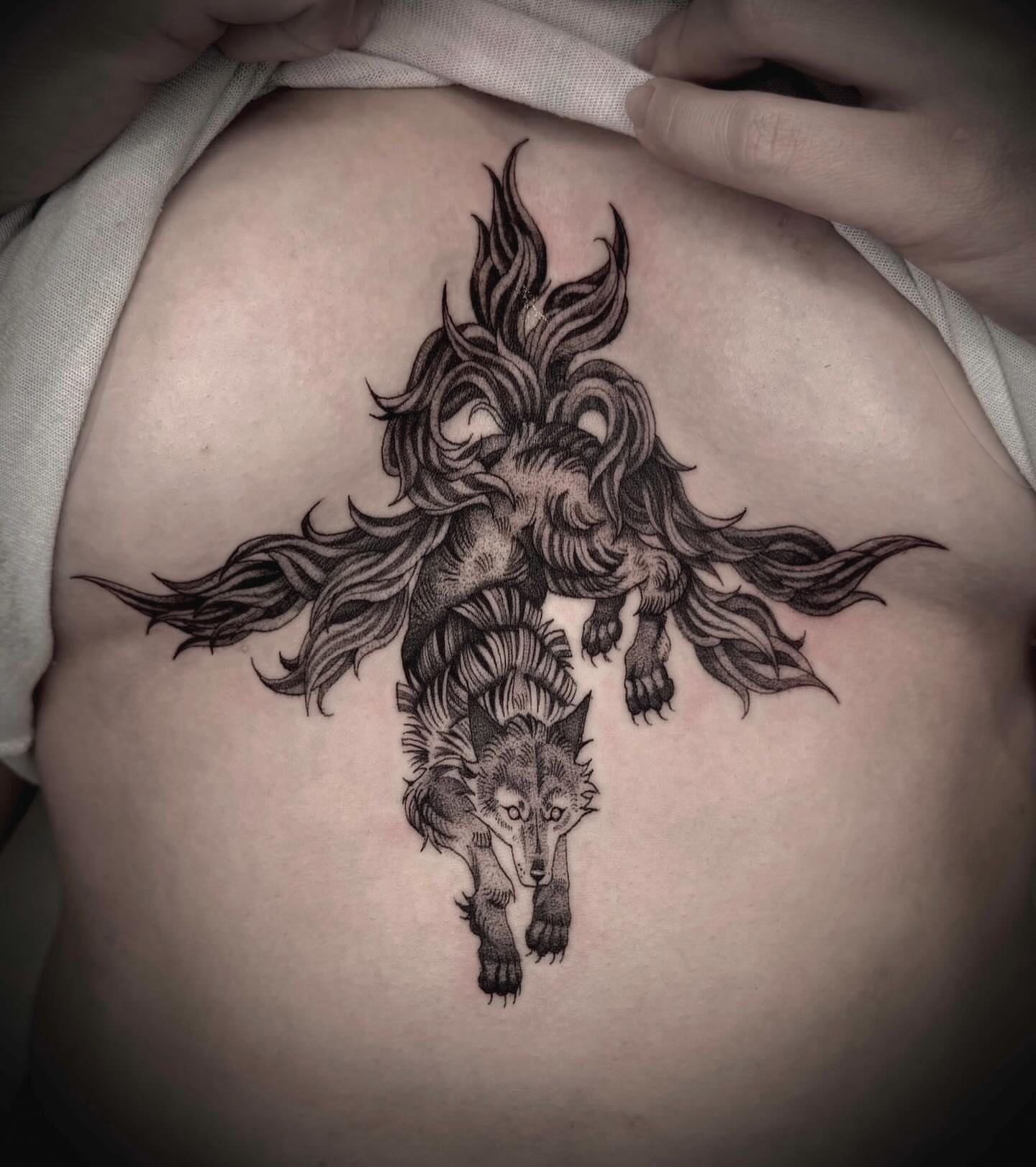 Wolf black and grey tattoo on the ribs by Melanie