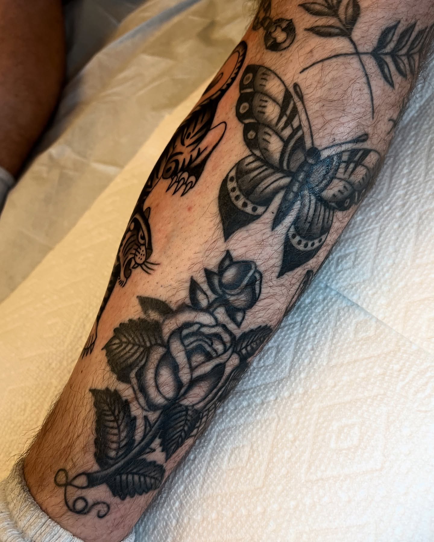 Butterflies and roses American traditional tattoo on the forearm by Syd Sayyah