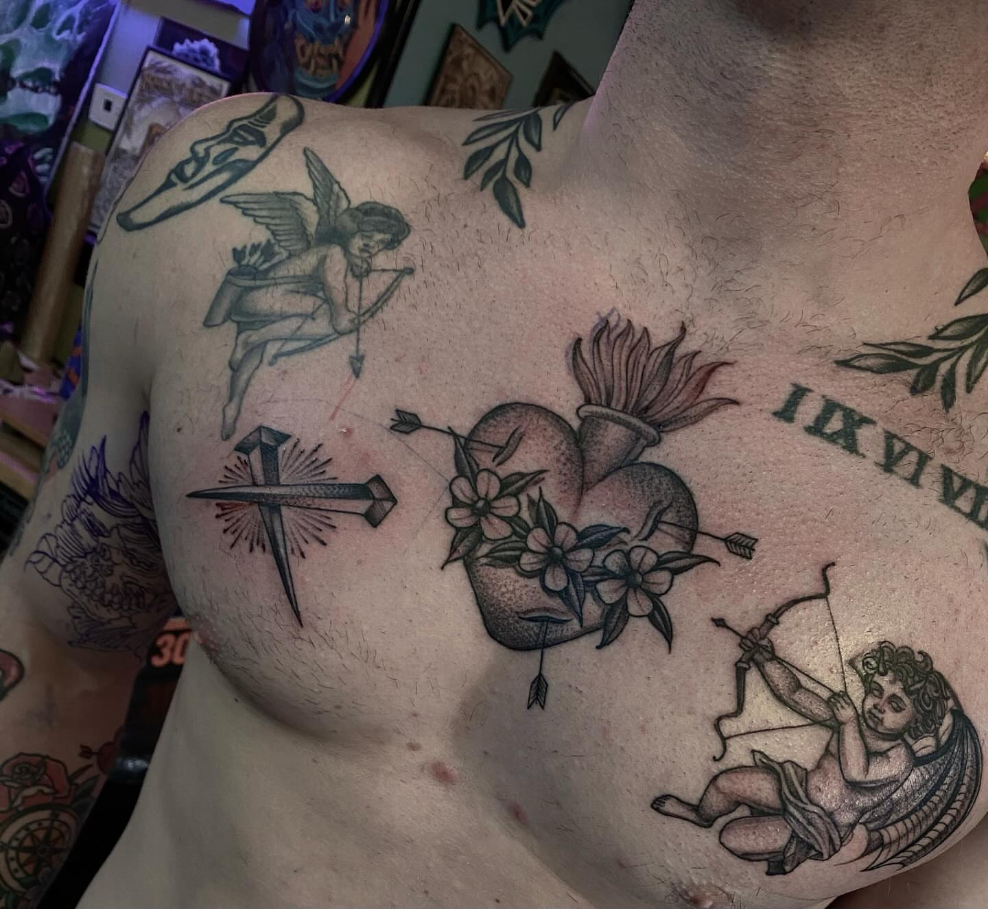 Heart with flowers black and grey tattoo on the chest by Chase Skylar Clayton Ogle