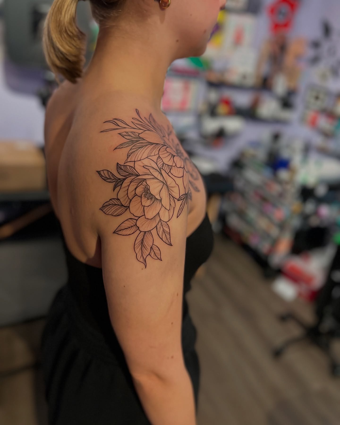 Floral bouquet black and grey tattoo on the shoulder by Rose DeLisse