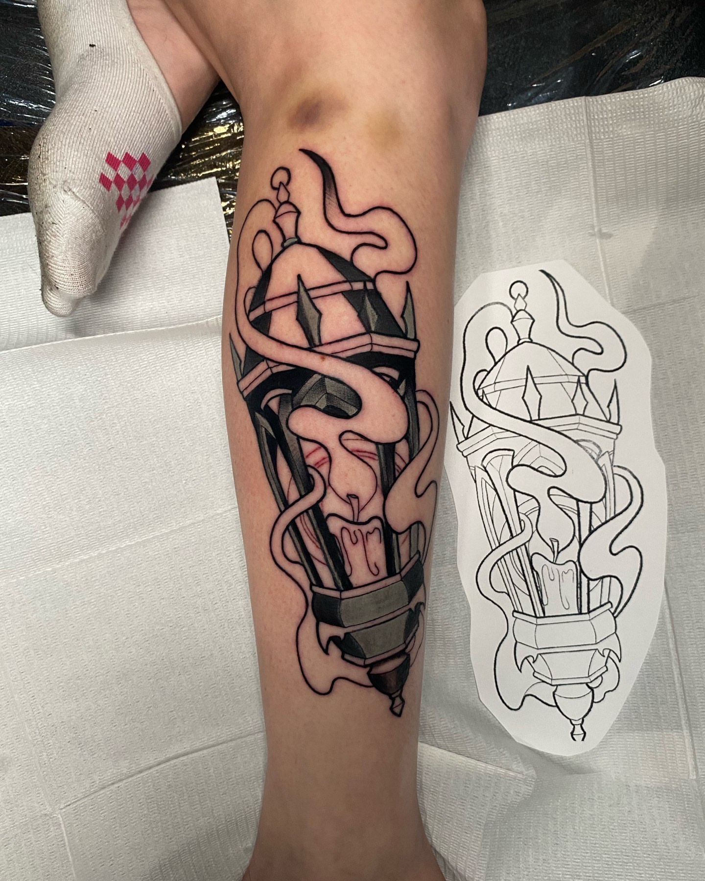 Candle and flame black and grey tattoo on the forearm by Brian Overholt