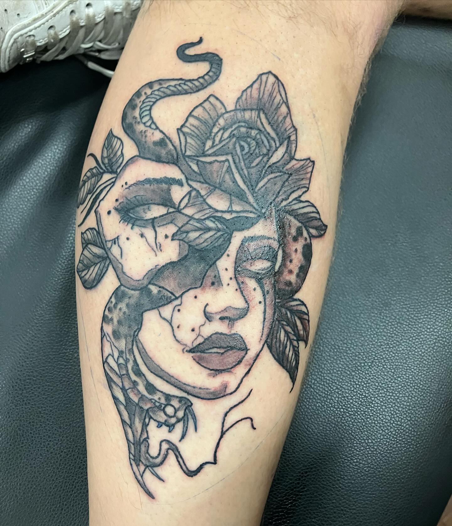 Woman's face with snake and rose realism tattoo on the forearm by Madeline, Akron, Ohio