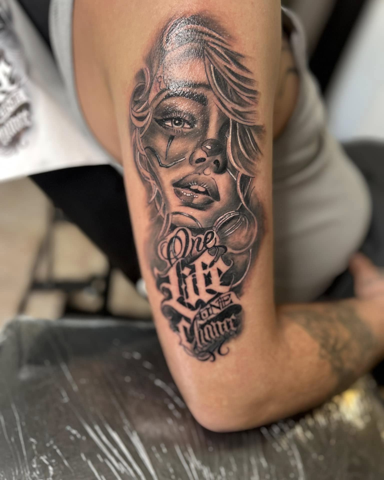 Woman's face realism tattoo on the forearm by Bryant Ramirez