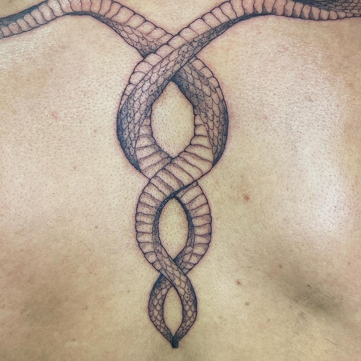 Infinite knot geometric tattoo on the chest by Libbey June @ Snailberry Studios- NW OHIO