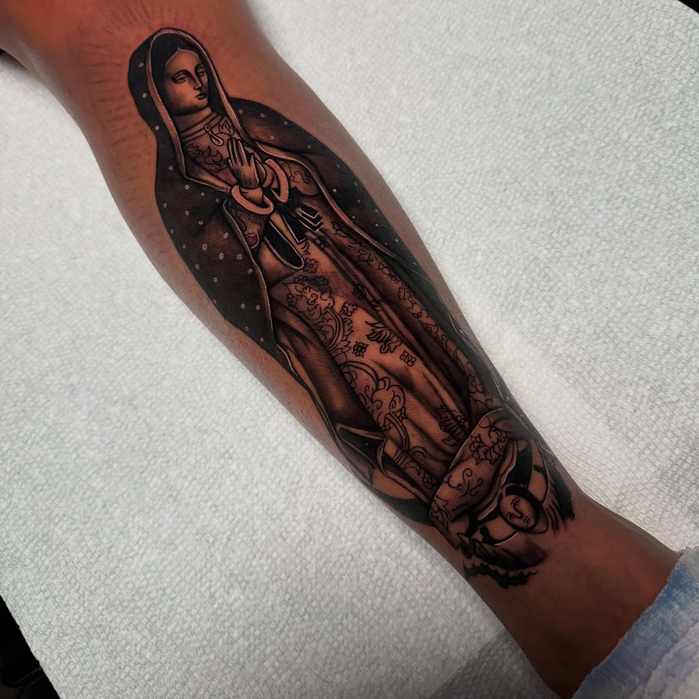 Our Lady of Guadalupe black and grey tattoo on the forearm by ๐ธ๐๐๐.๐ฎ๐, Los Angeles, California