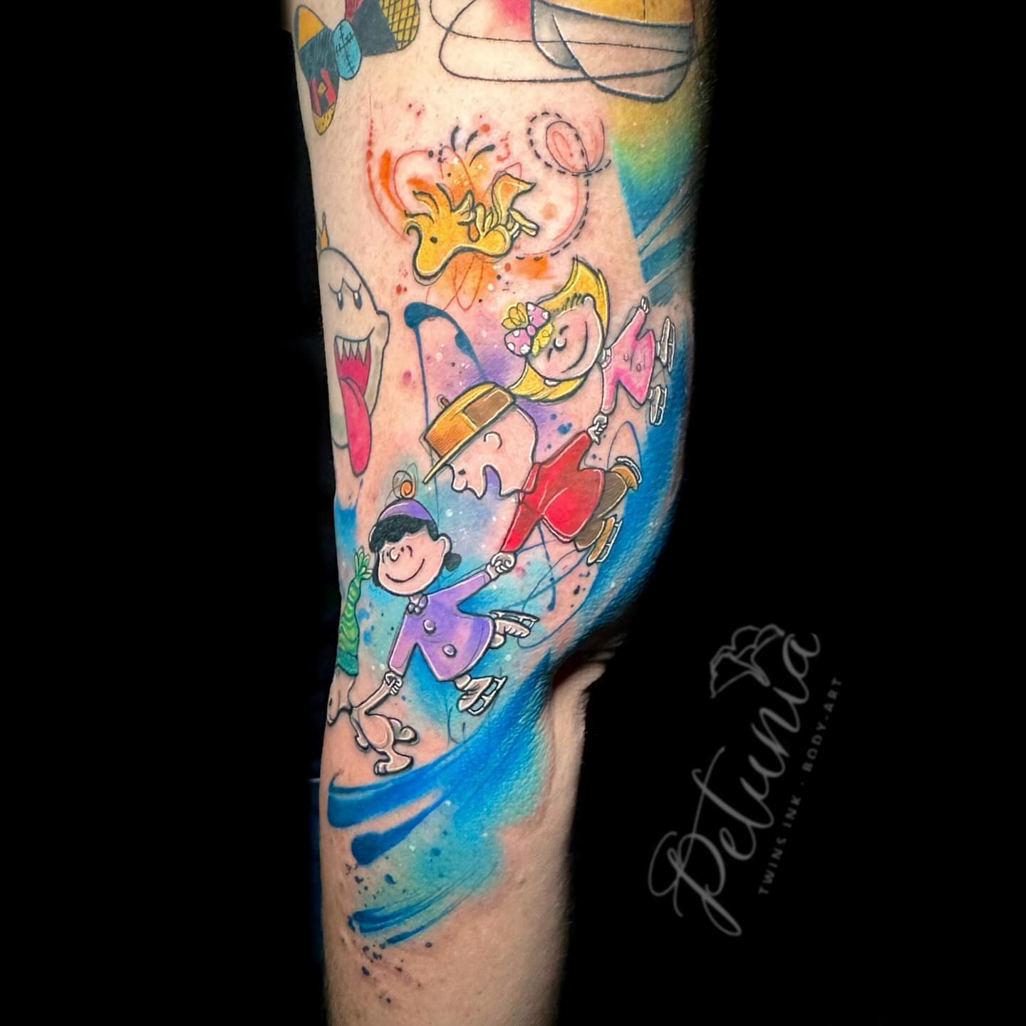 Charlie brown and friends watercolor tattoo on the forearm by Alena Petunia