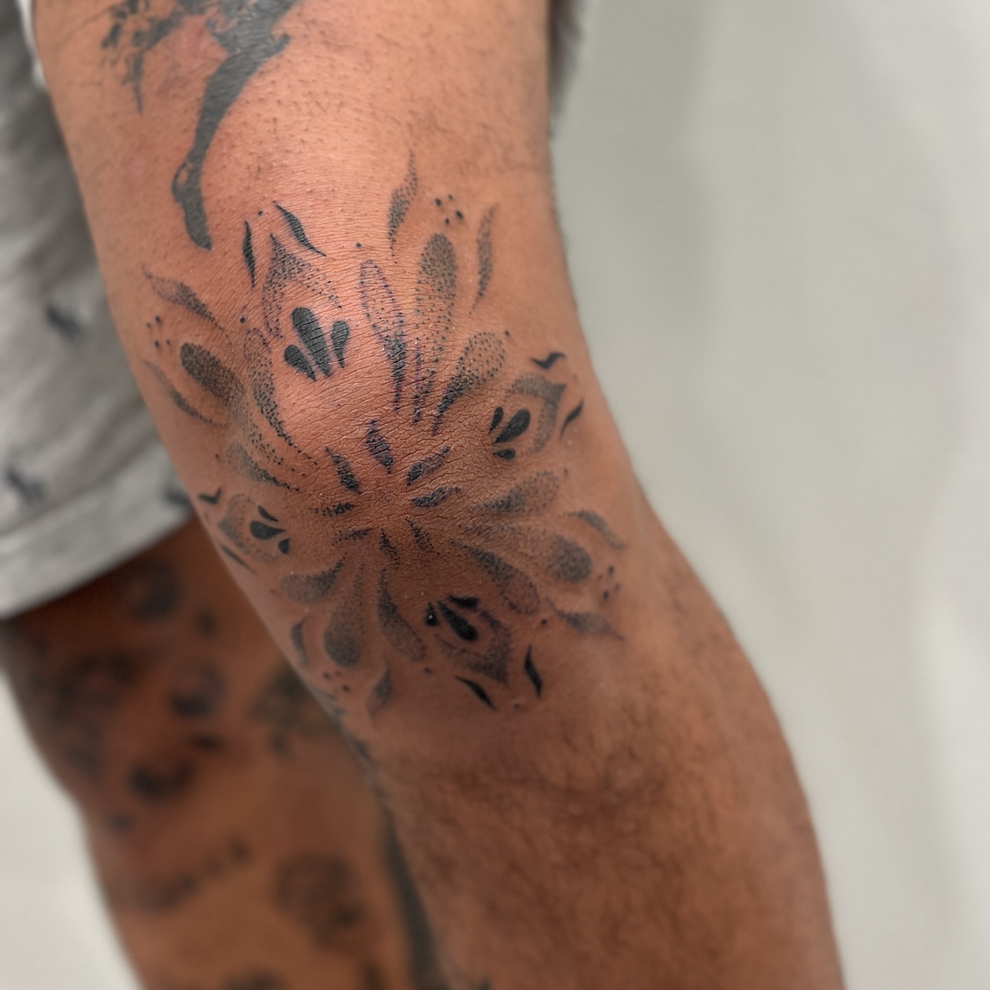 Flower dotwork tattoo on the forearm by Alex