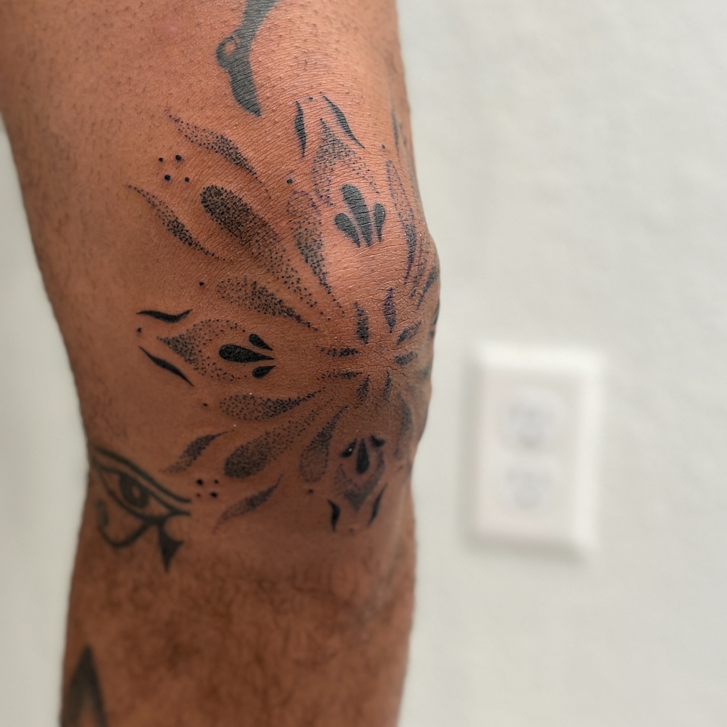 Lotus flower dotwork tattoo on the leg by Alex