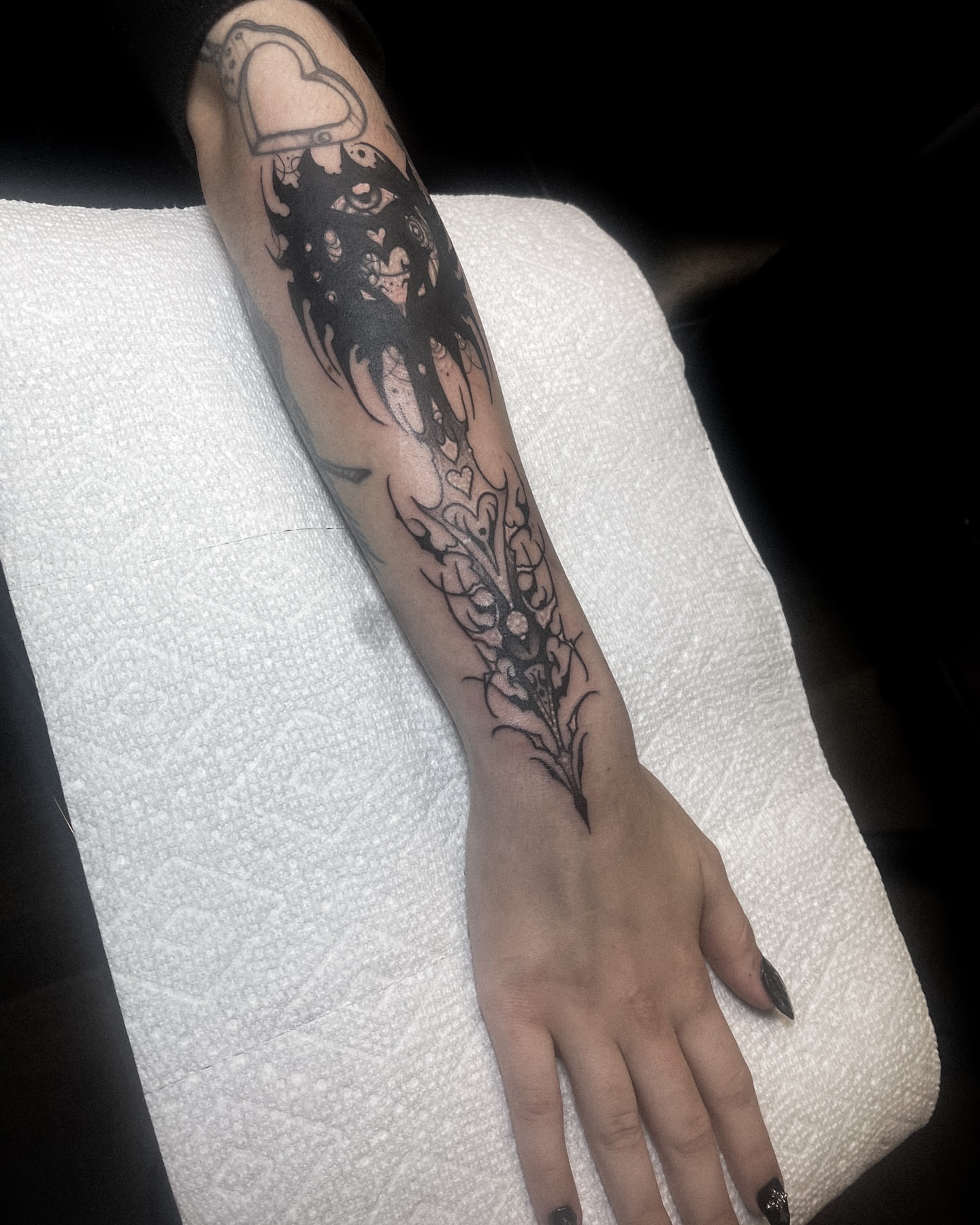Abstract floral design black and grey tattoo on the forearm by Ema Fish