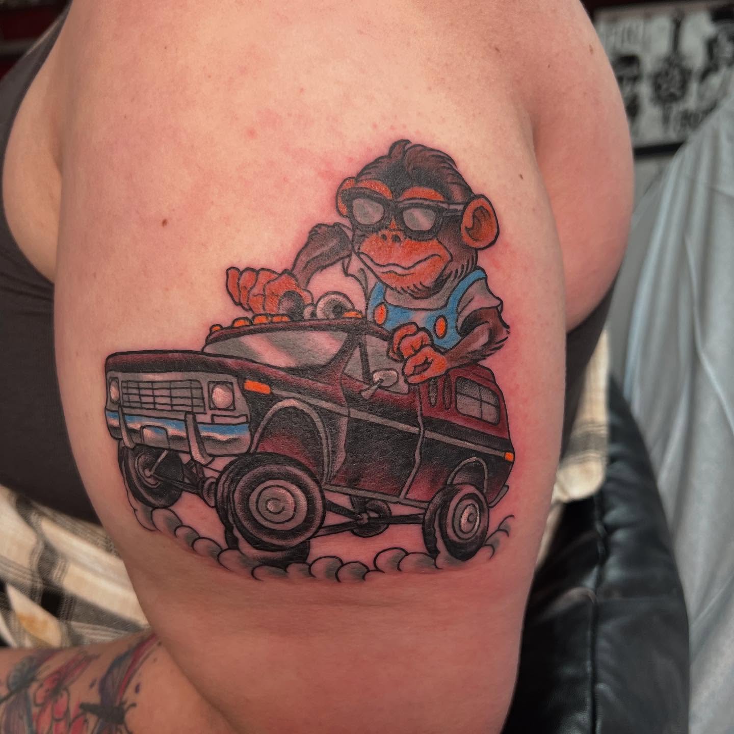 Monkey driving truck realism tattoo on the thigh by Dustin Hysell