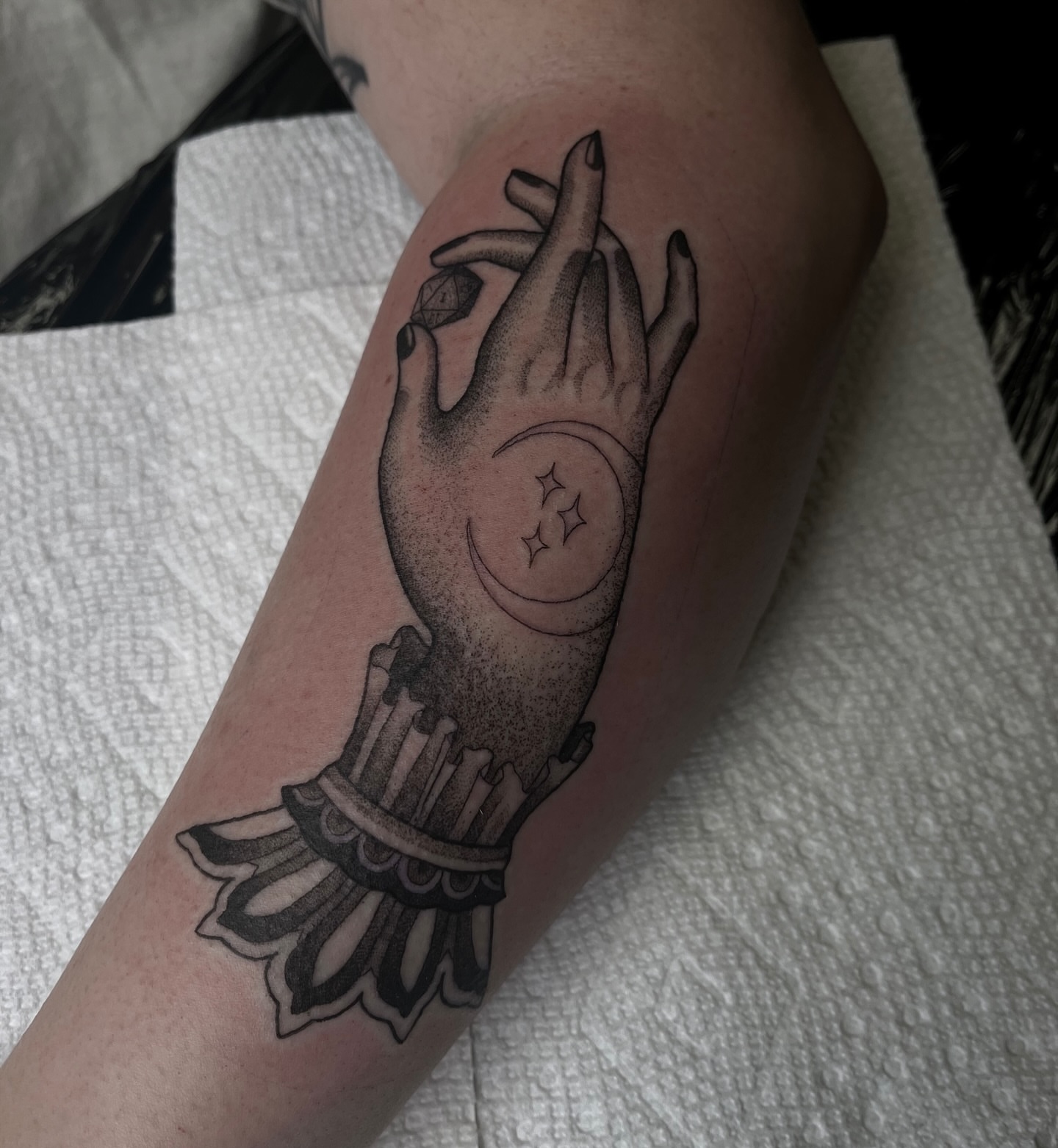 Hand with candle and moon dotwork tattoo on the forearm by ๐๐๐๐๐๐๐