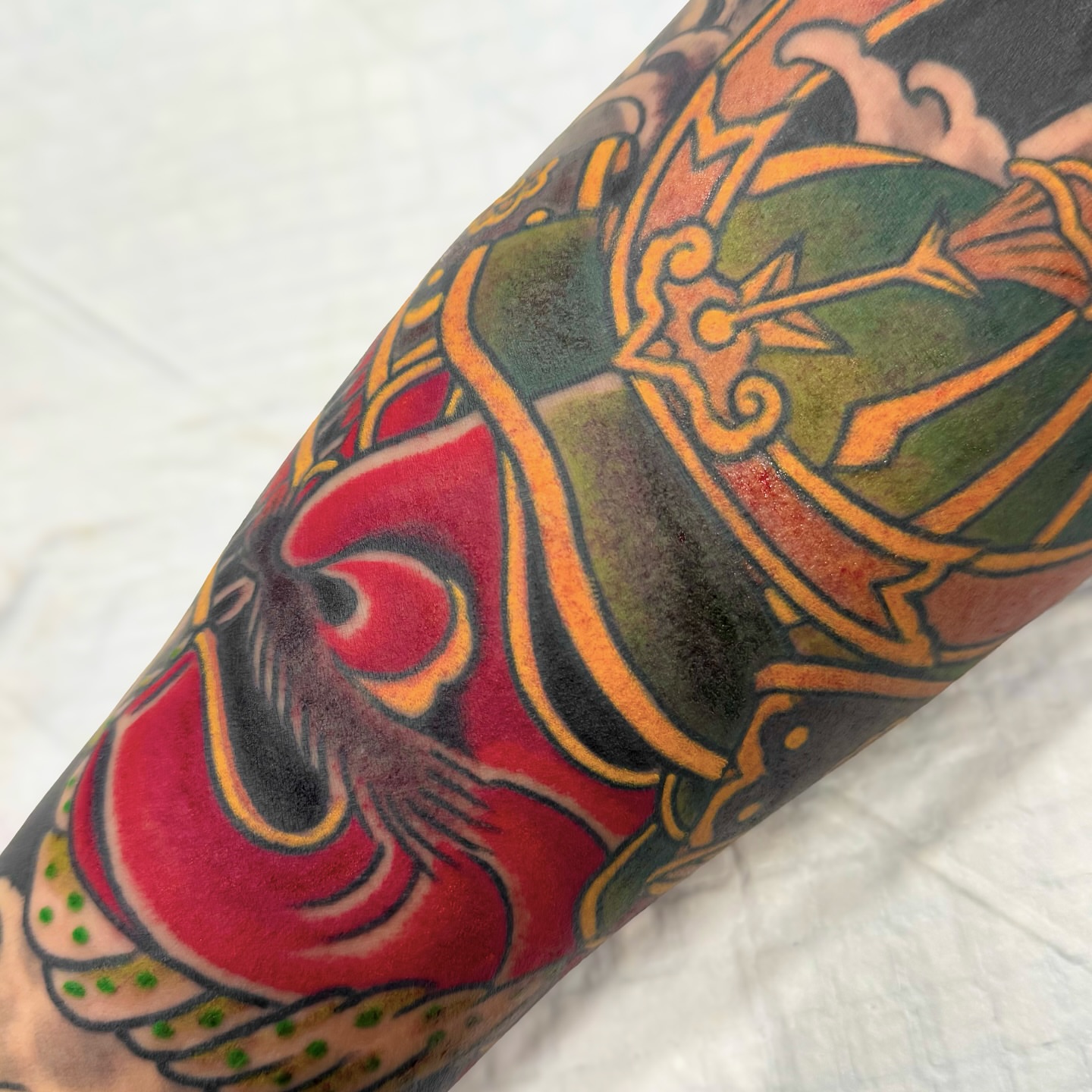 Dragon and shield American traditional tattoo on the forearm by Marcos Rivera, Laredo, Texas